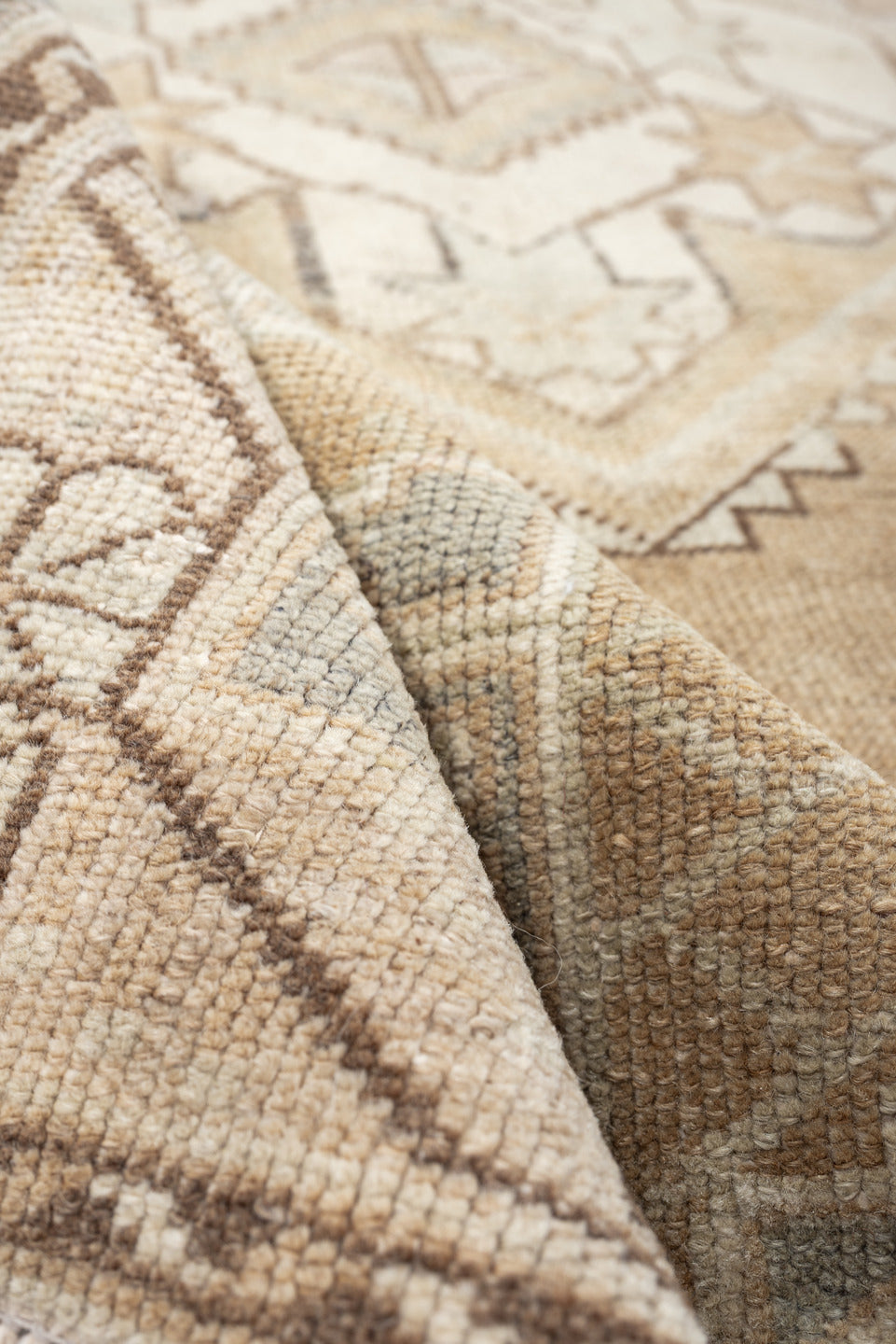 3' x 6' one-of-a-kind handmade vintage Kurd runner rug. Color palette: camel, ivory, pale blue, taupe, sand, light brown