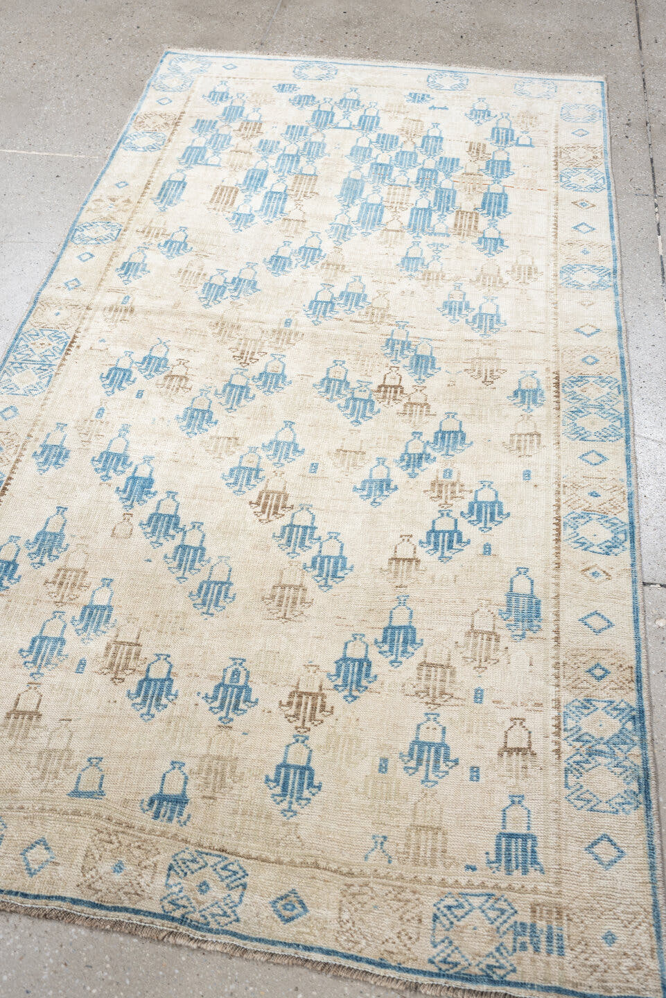 3' x 6' one-of-a-kind handmade antique rug. Color palette: ivory, sky blue, beige, taupe, light blue, gray