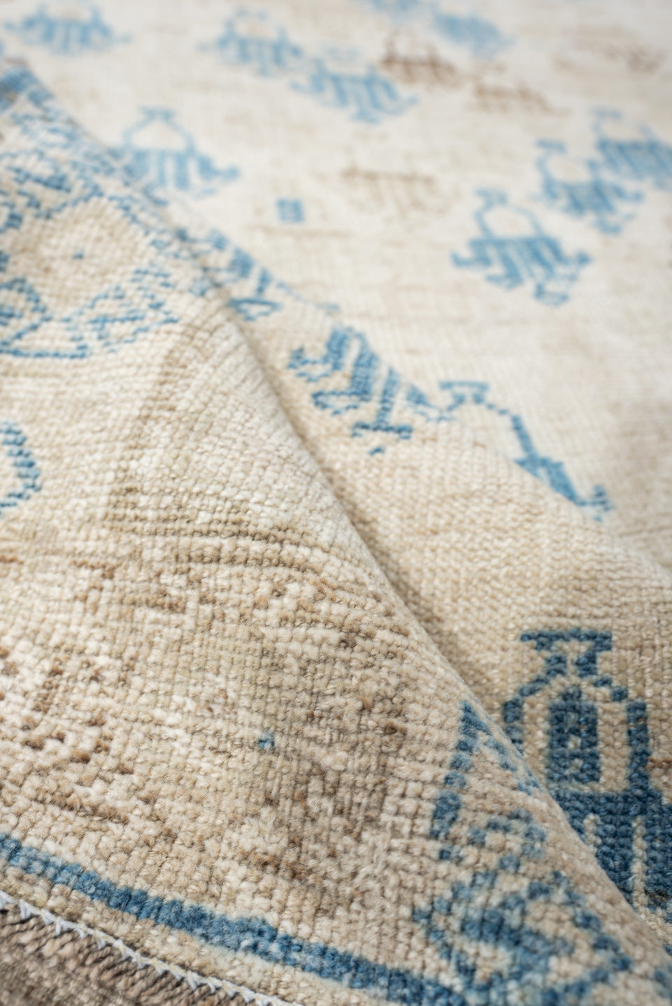 3' x 6' one-of-a-kind handmade antique rug. Color palette: ivory, sky blue, beige, taupe, light blue, gray