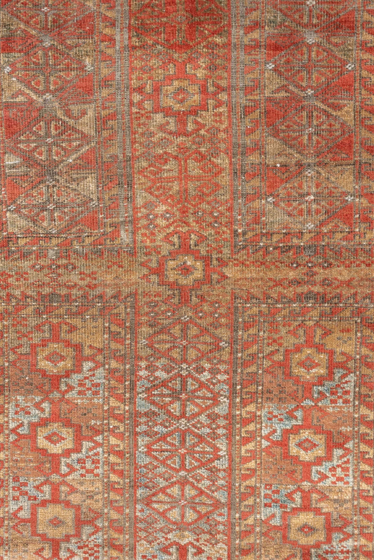 3' x 7' one-of-a-kind handmade antique Belouch rug. Color palette: terracotta, ivory, camel, taupe, rust, pale blue, brown