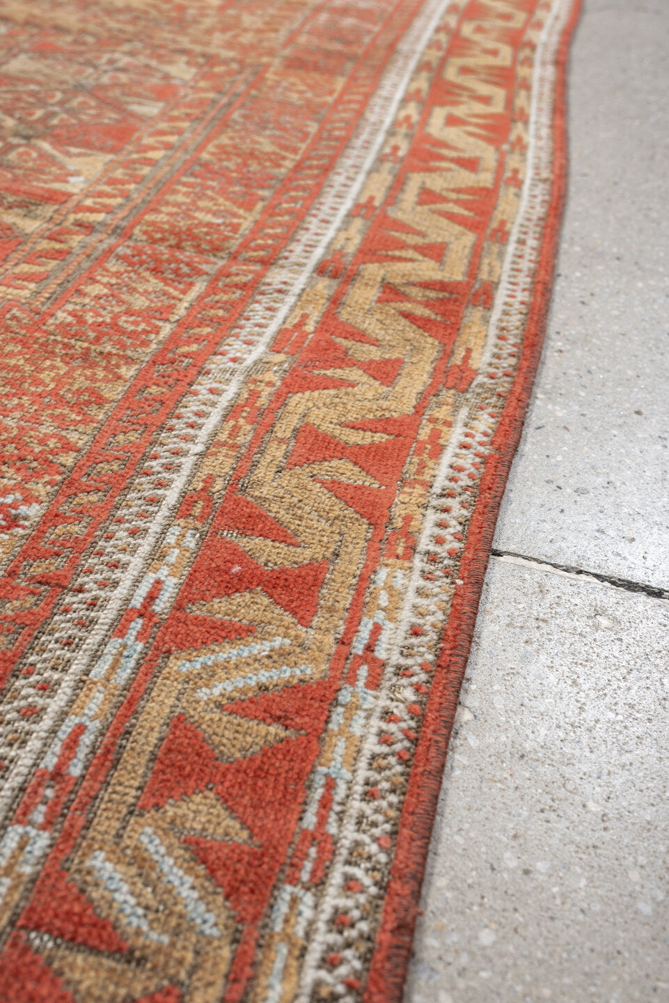 3' x 7' one-of-a-kind handmade antique Belouch rug. Color palette: terracotta, ivory, camel, taupe, rust, pale blue, brown
