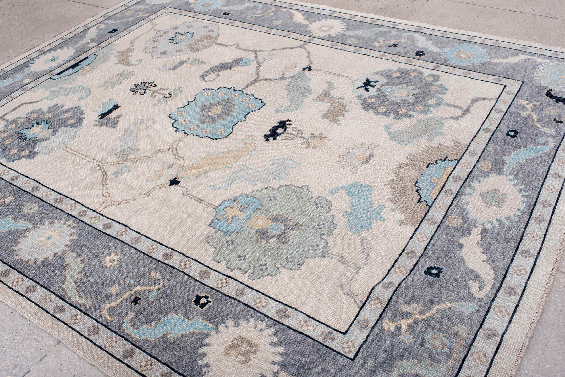 8' x 10' one-of-a-kind handmade vintage Oushak large size rug. Color palette: ivory, gray, pale blue, taupe, charcoal, cream