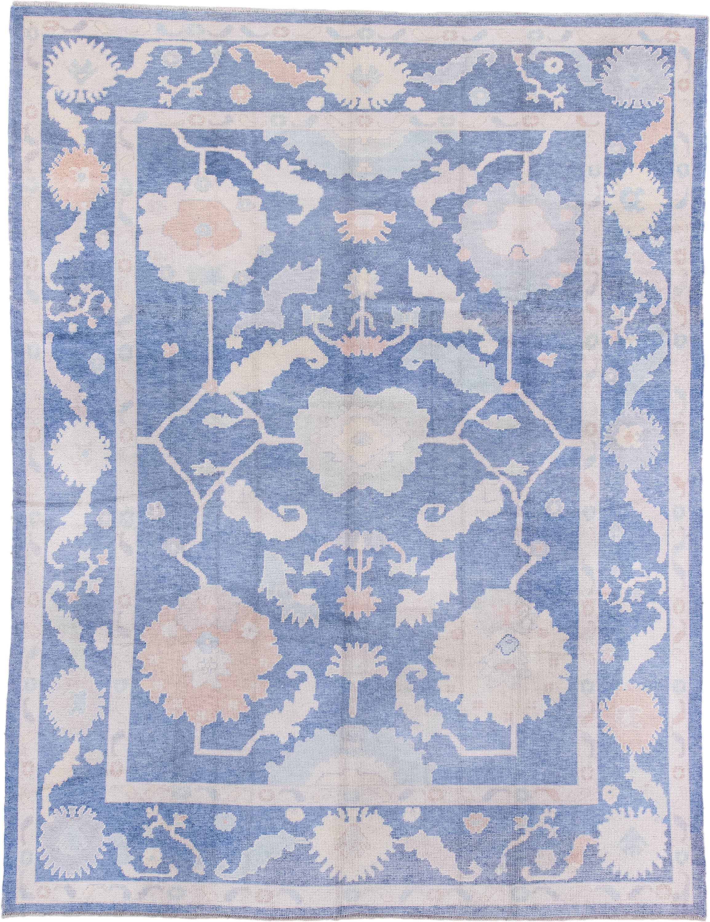 8' x 11' one-of-a-kind handmade vintage Oushak large size rug. Color palette: powder blue, ivory, blush, pale peach