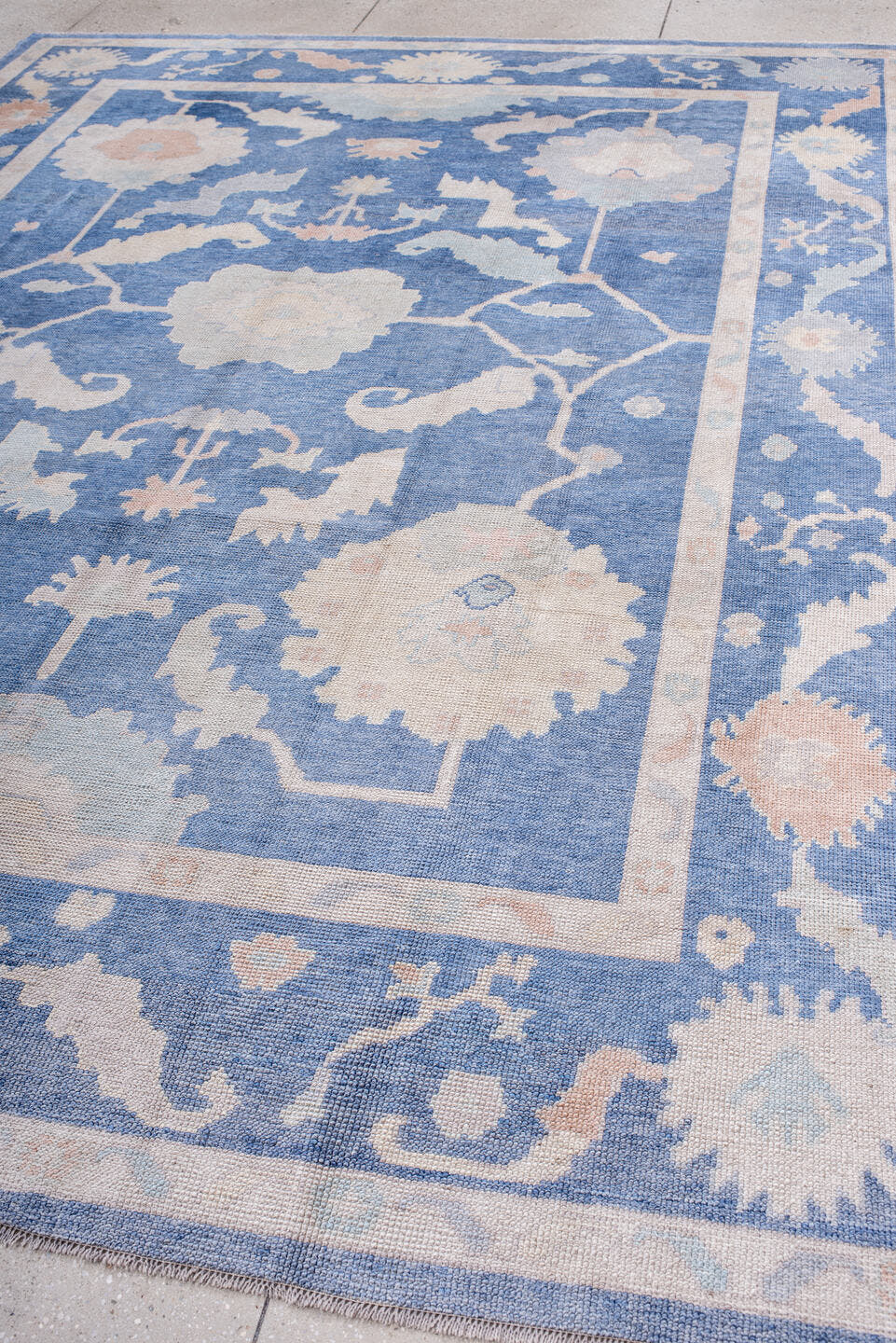 8' x 11' one-of-a-kind handmade vintage Oushak large size rug. Color palette: powder blue, ivory, blush, pale peach