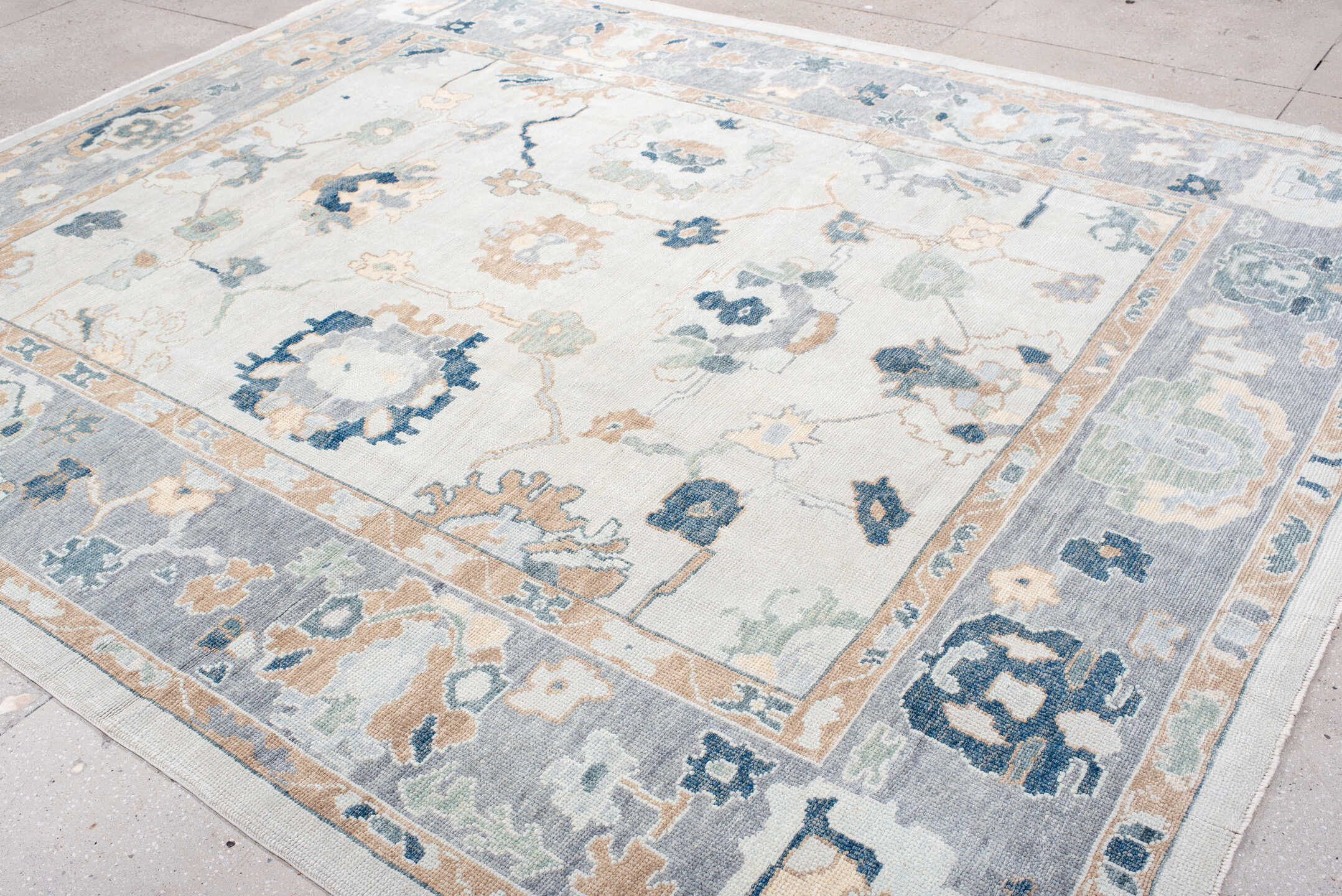 9' x 11' one-of-a-kind handmade vintage Oushak large size rug. Color palette: ivory, slate, peach, sage, navy, cream, taupe