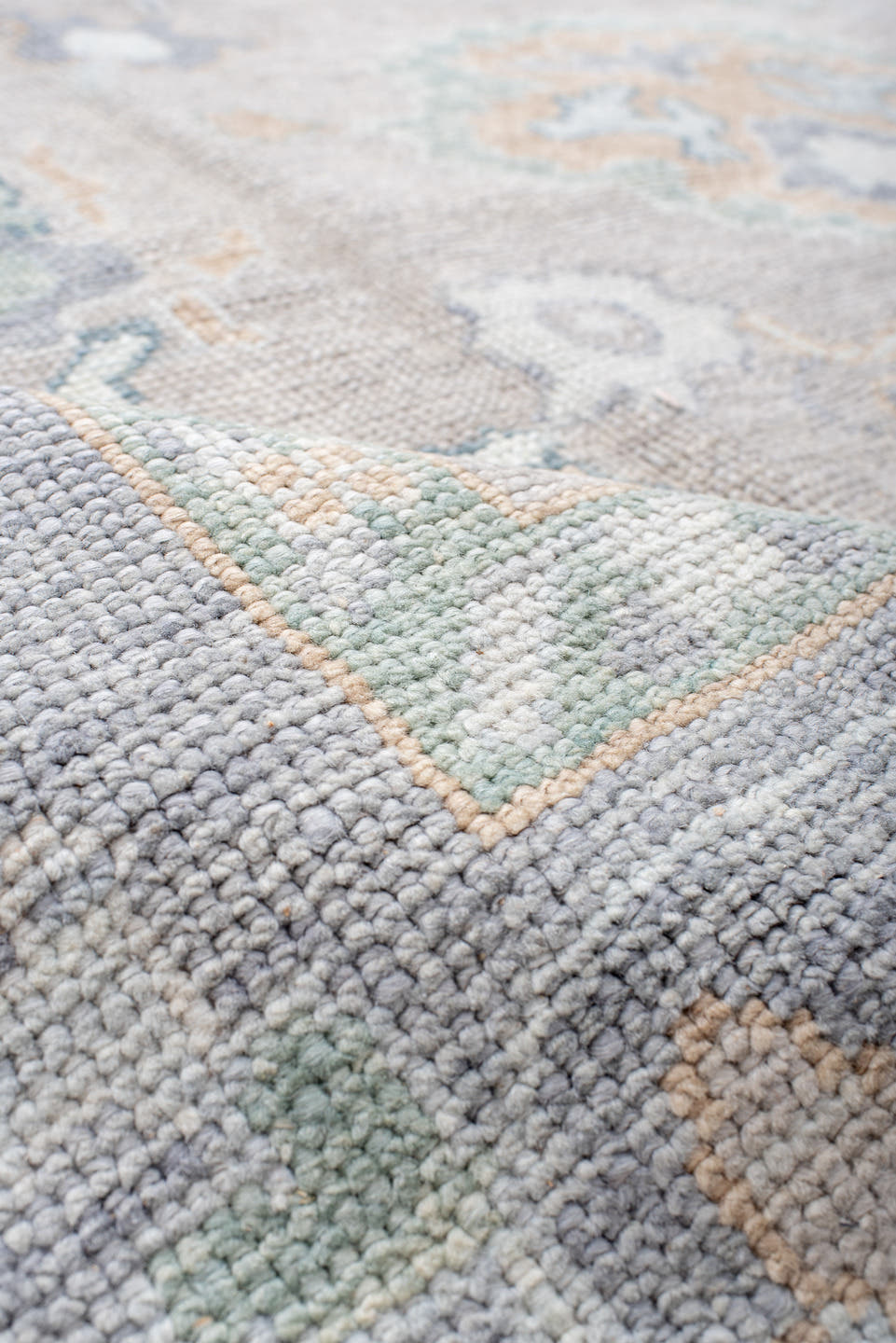8' x 9' one-of-a-kind handmade vintage Oushak rug. Color palette: taupe, pale blue, ivory, sage, soft gold, peach, slate