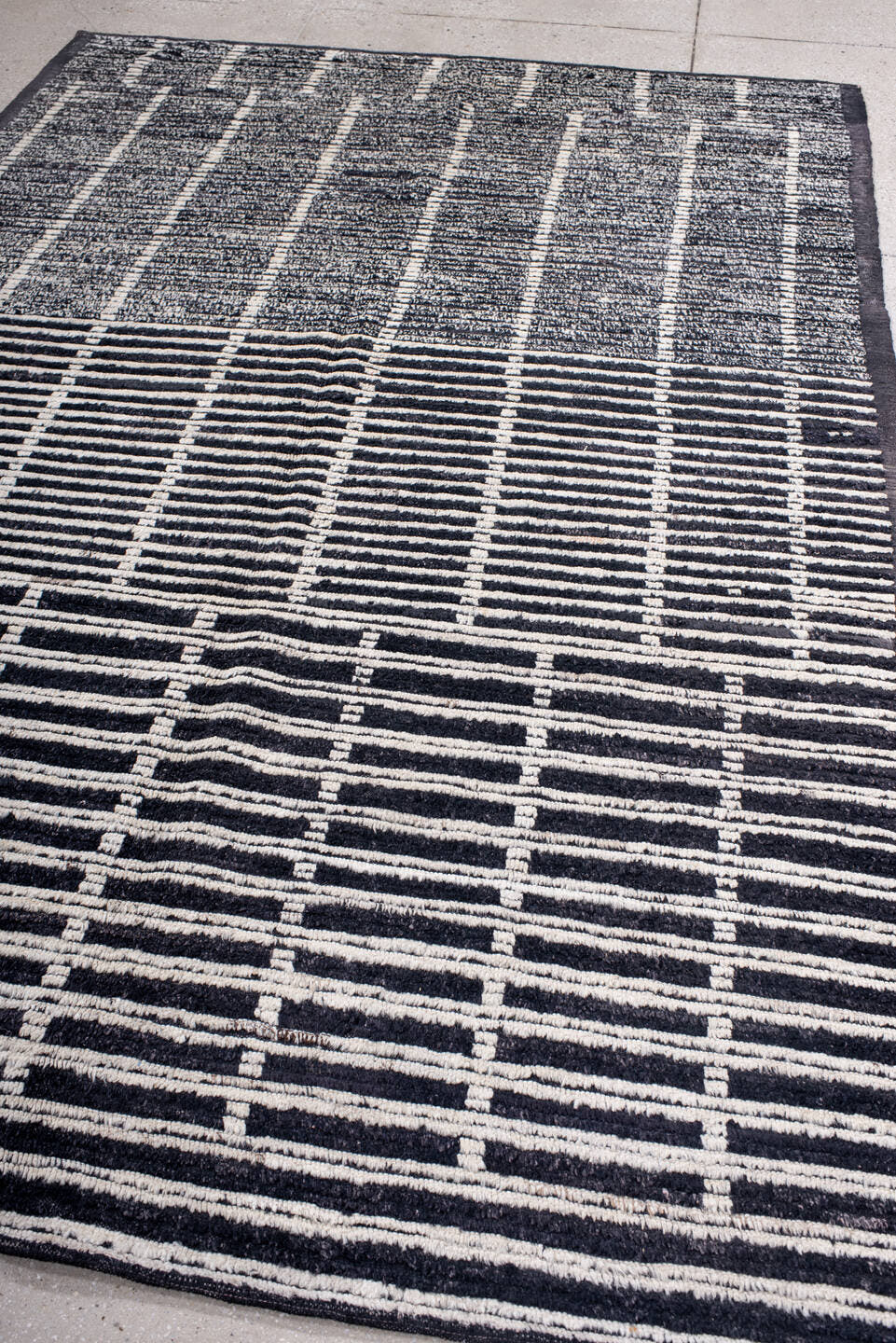 6' x 8' one-of-a-kind handmade vintage Tulu medium size rug. Color palette: black, ivory, charcoal, slate, gray
