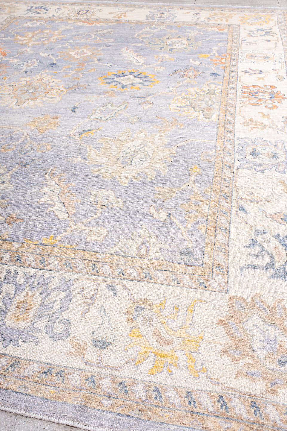 11' x 15' one-of-a-kind handmade vintage Oushak oversize rug. Color palette: lavender, ivory, pale gold, soft blue, taupe