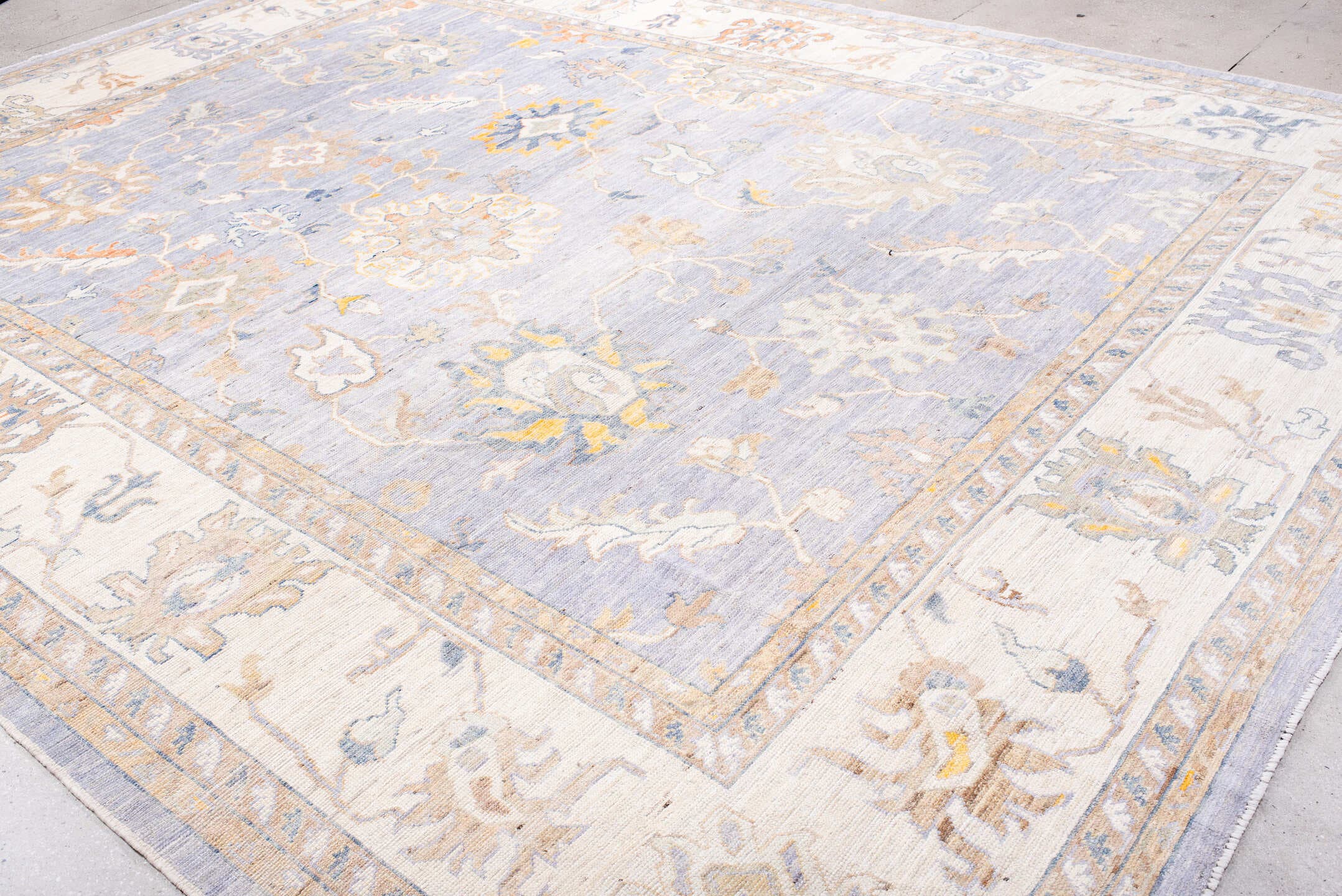 11' x 15' one-of-a-kind handmade vintage Oushak oversize rug. Color palette: lavender, ivory, pale gold, soft blue, taupe
