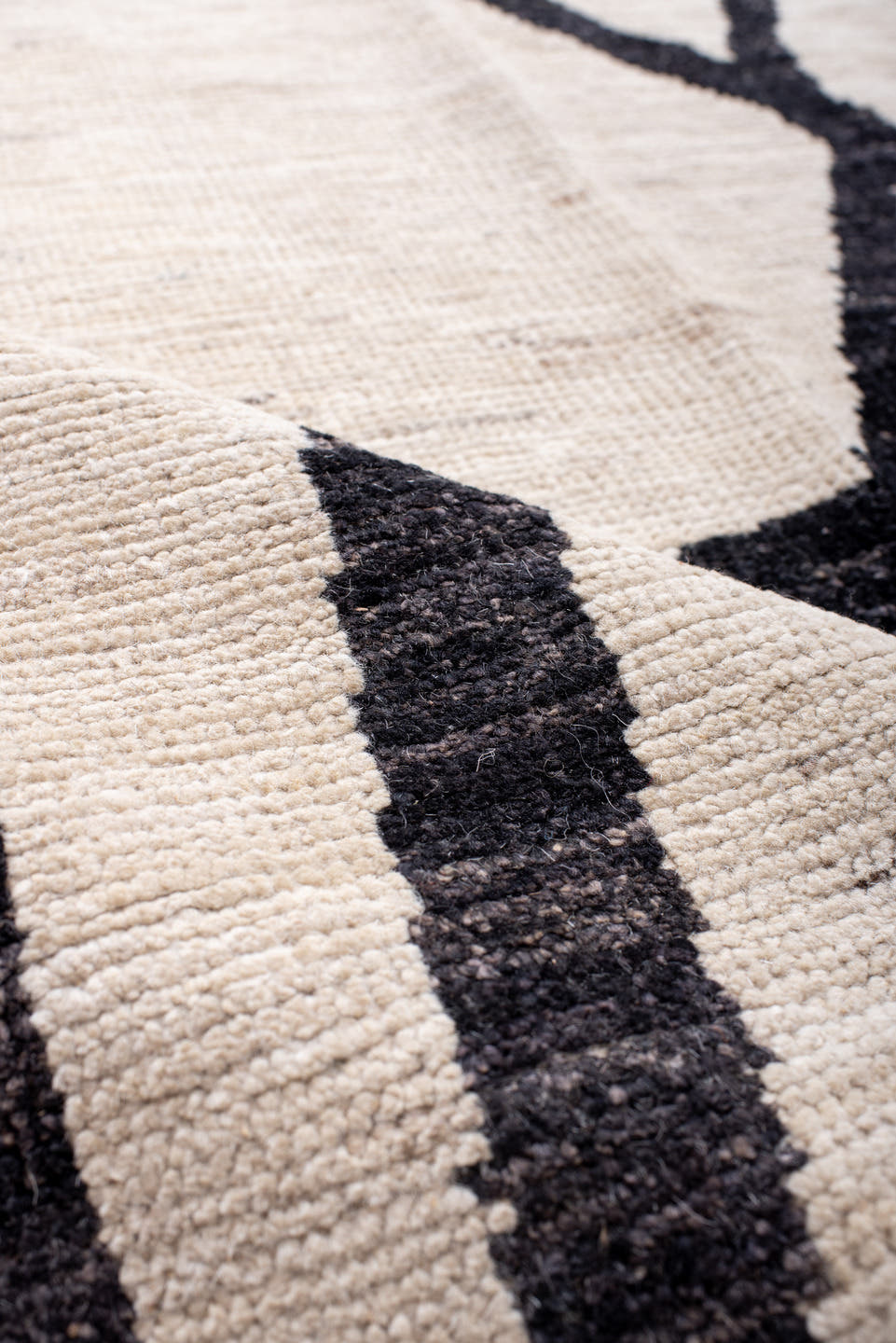 9' x 12' one-of-a-kind handmade vintage Tulu large size rug. Color palette: ivory, charcoal, black, gray