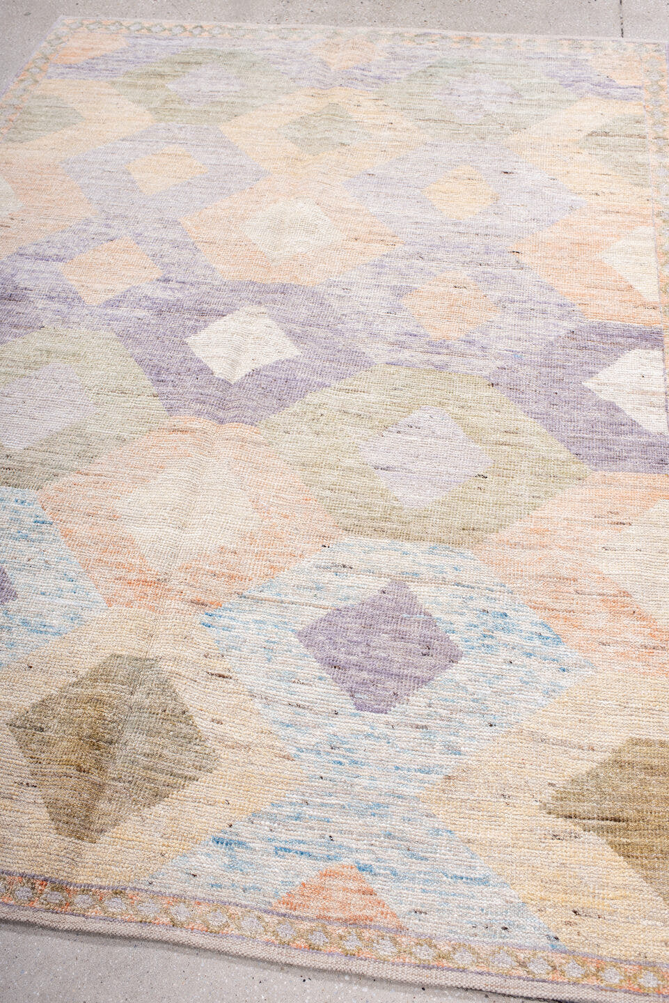 5' x 7' one-of-a-kind handmade vintage Tulu rug. Color palette: ivory, lilac, blush, pale blue, taupe, sage, purple, pink