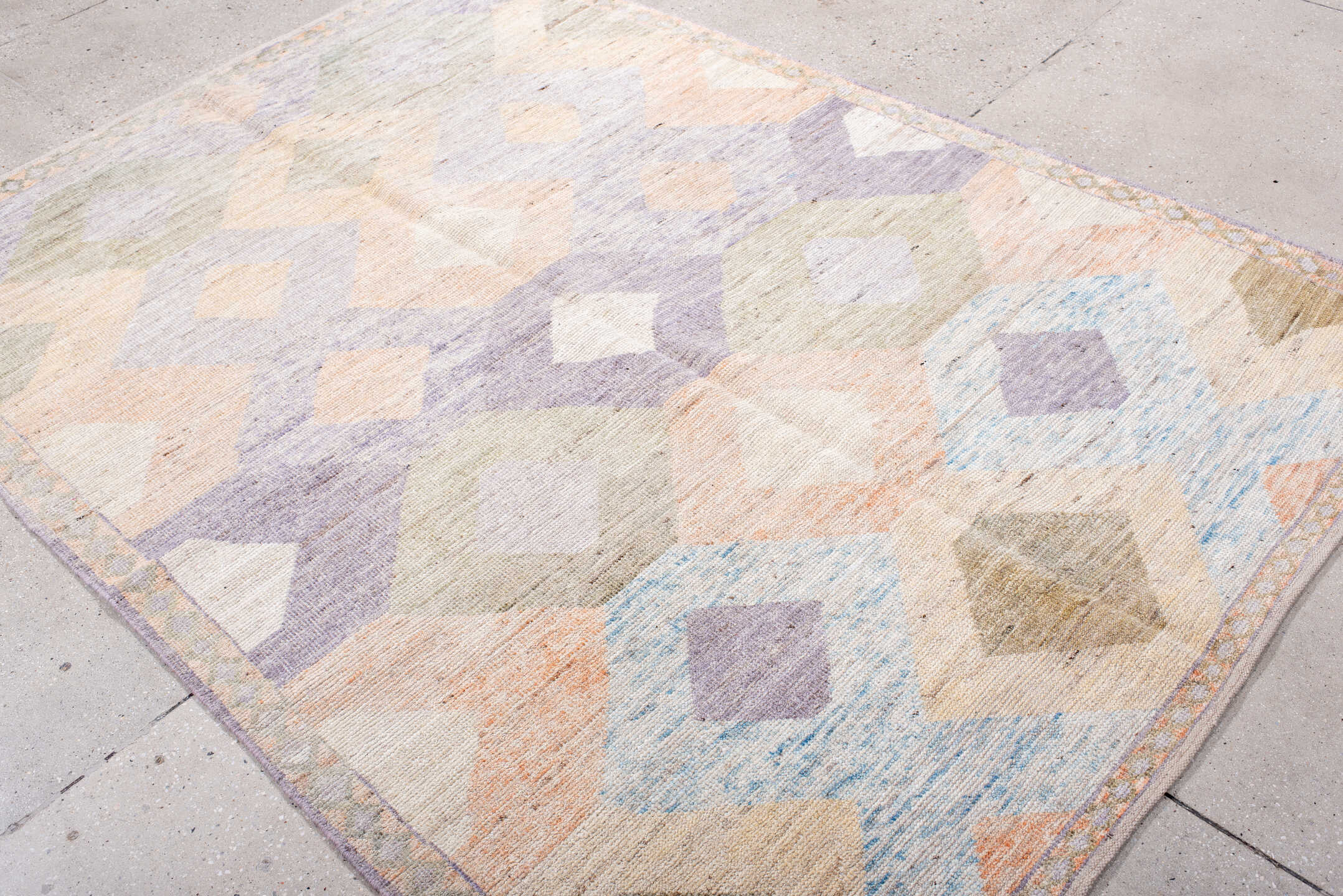 5' x 7' one-of-a-kind handmade vintage Tulu rug. Color palette: ivory, lilac, blush, pale blue, taupe, sage, purple, pink