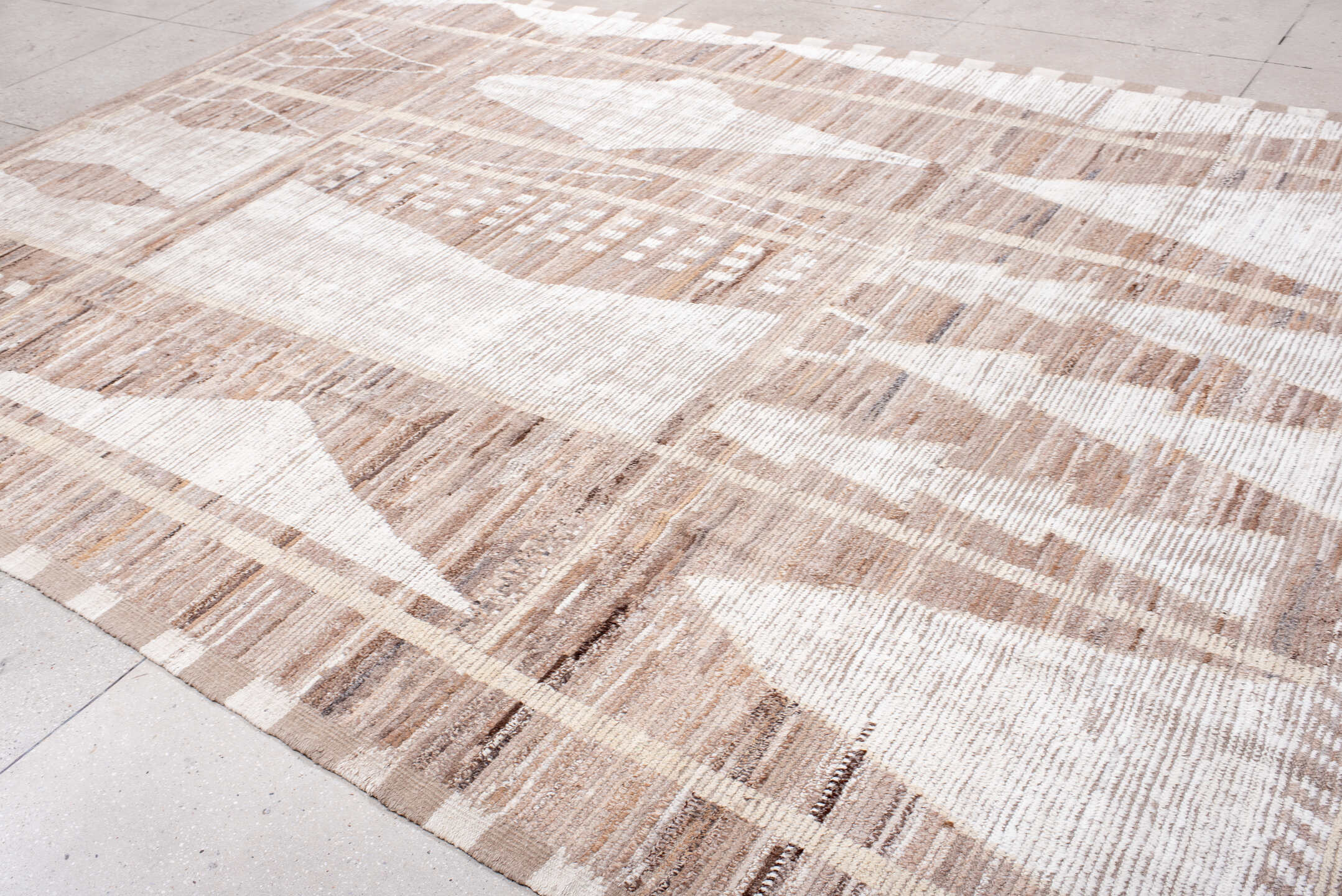 9' x 13' one-of-a-kind handmade vintage Tulu large size rug. Color palette: ivory, taupe, camel, beige, brown, gray