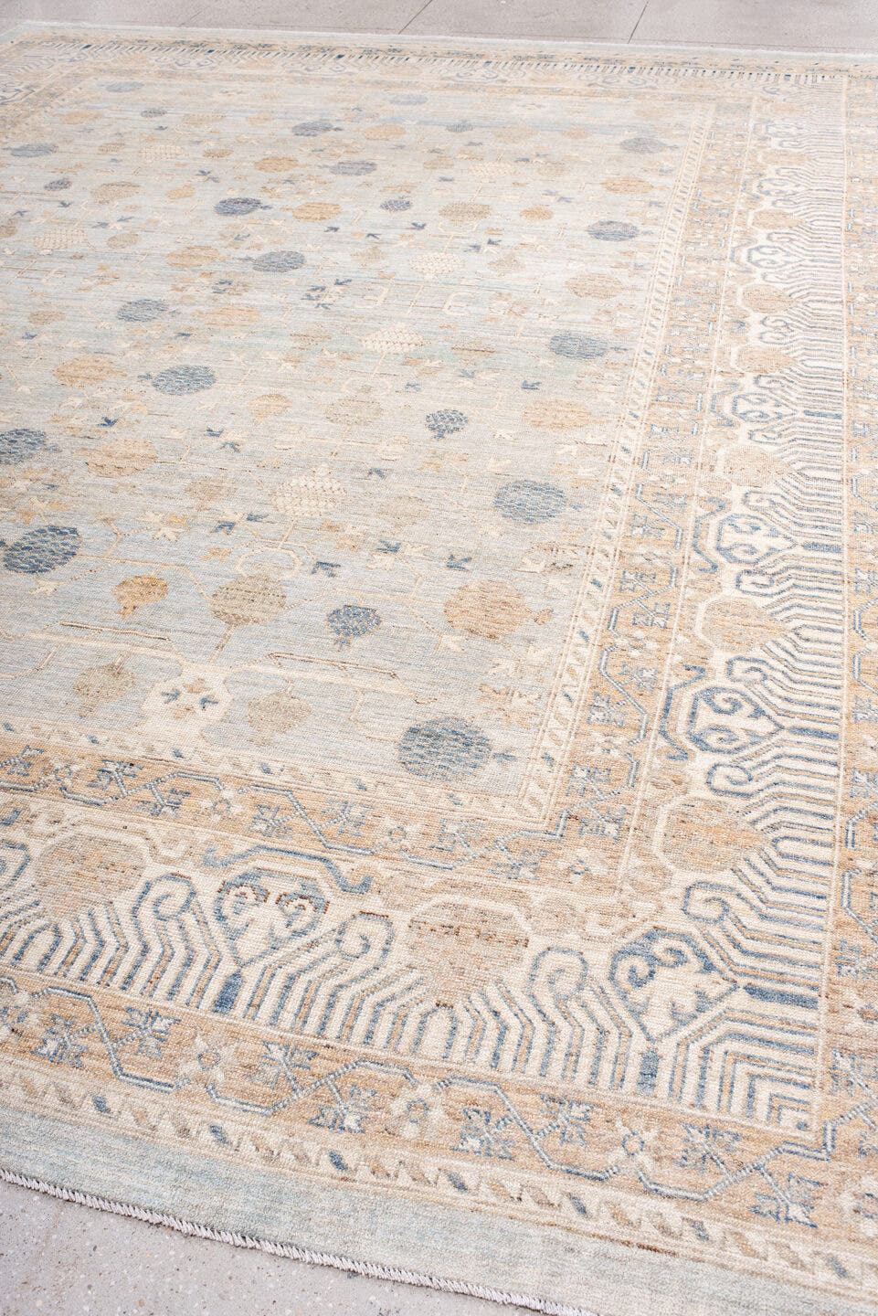 12' x 15' one-of-a-kind handmade vintage Khotan oversize rug. Color palette: ivory, pale blue, sand, beige, taupe