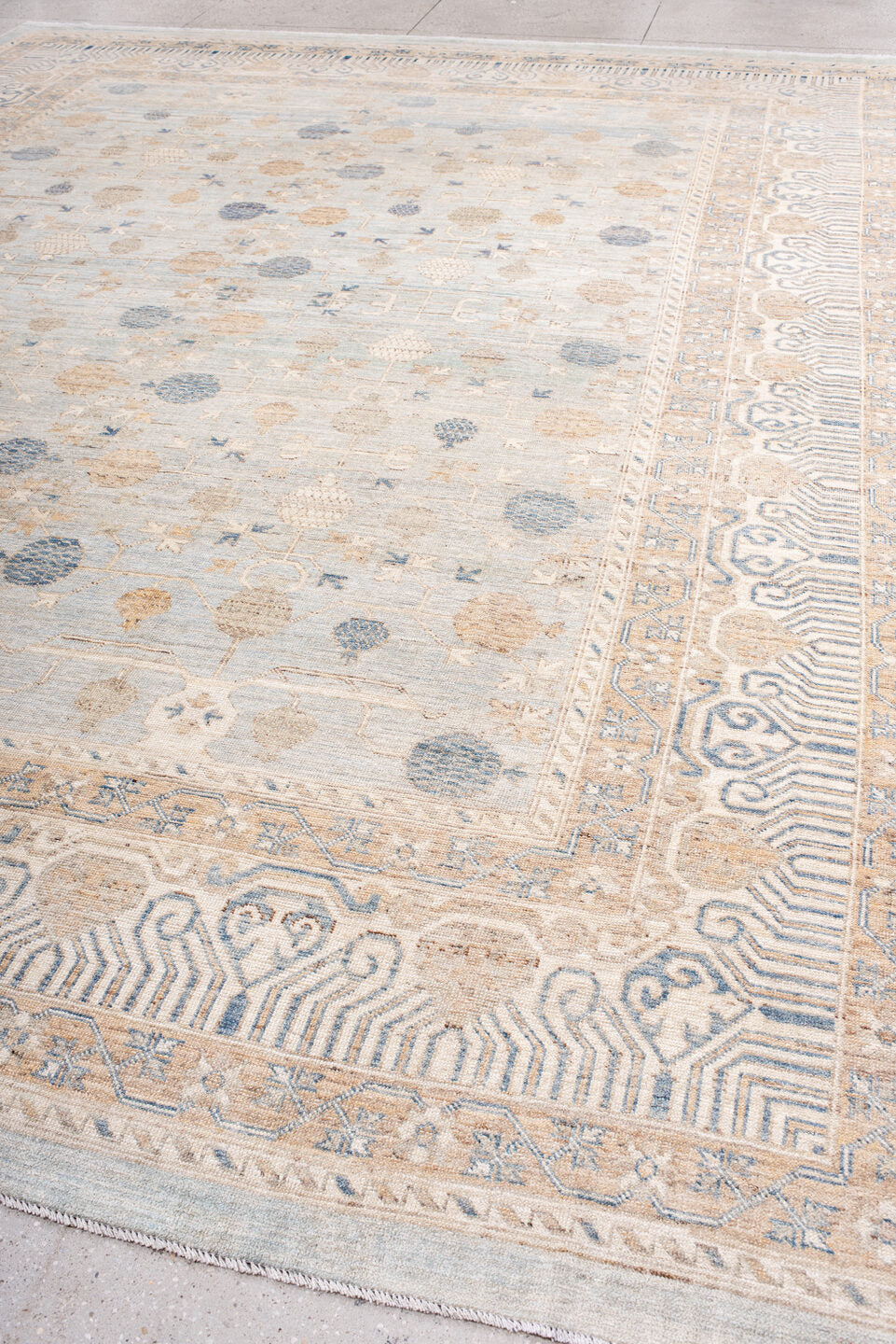 12' x 15' one-of-a-kind handmade vintage Khotan oversize rug. Color palette: ivory, pale blue, sand, beige, taupe