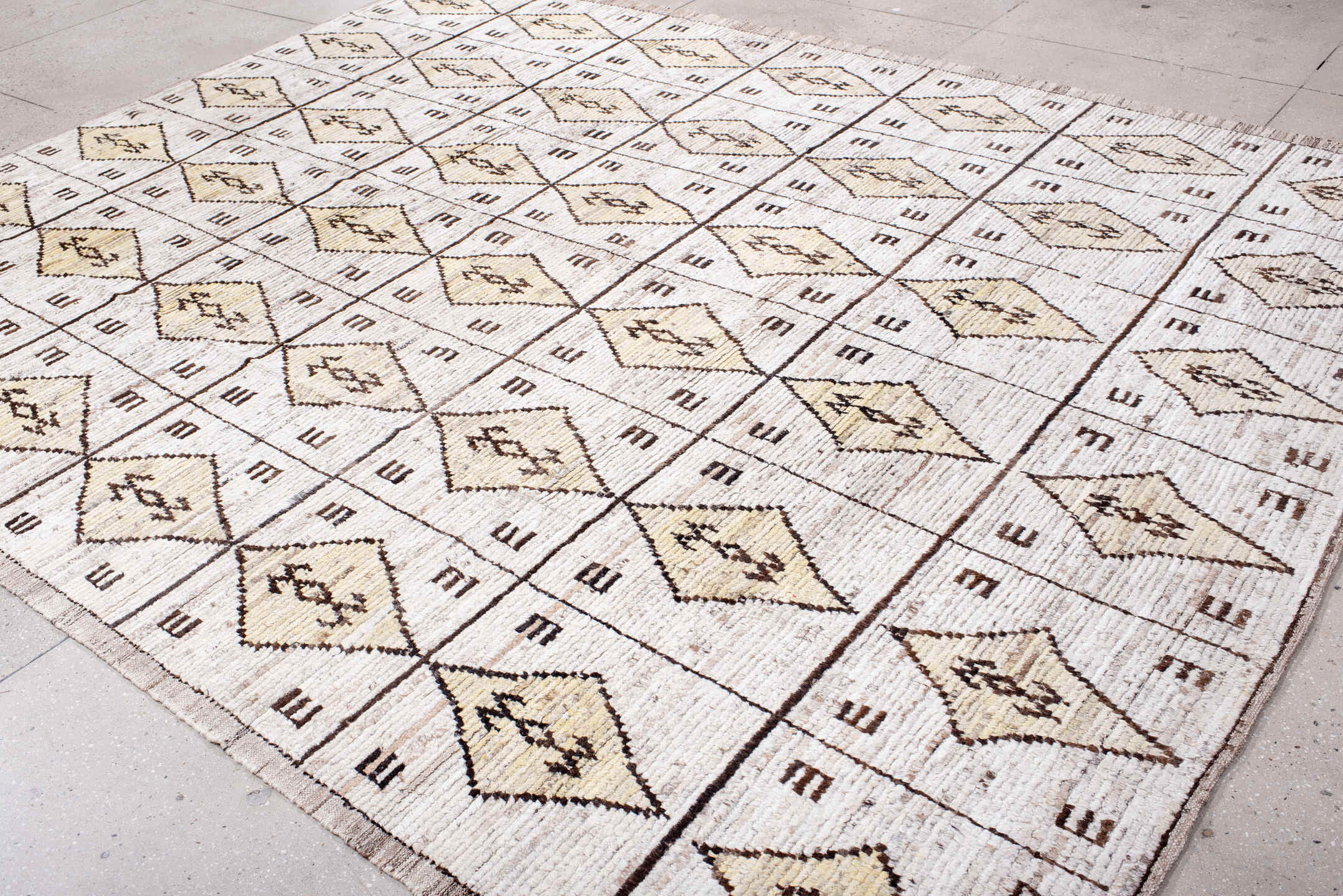 9' x 11' one-of-a-kind handmade vintage Tulu large size rug. Color palette: cream, ivory, taupe, brown, camel, beige, gray