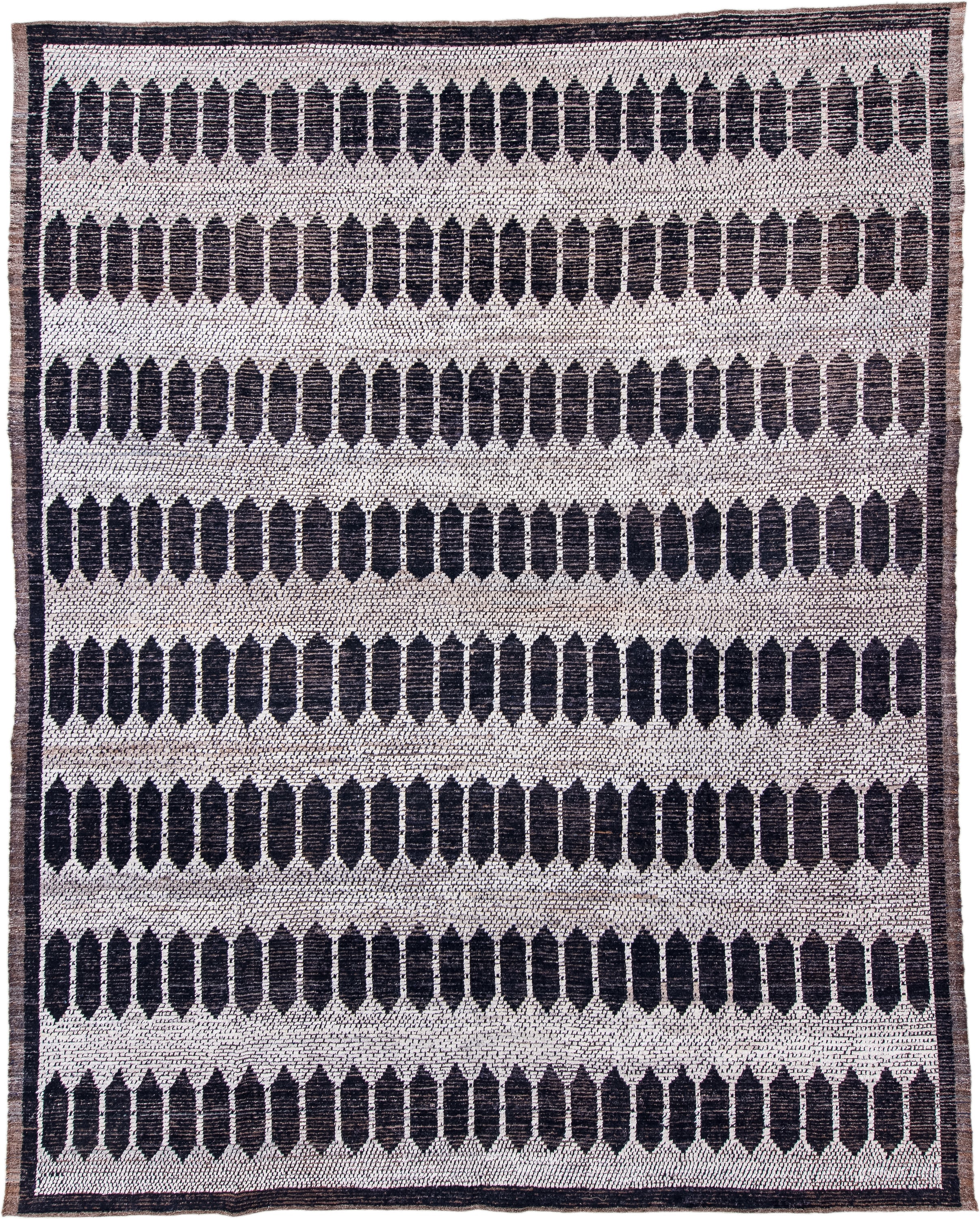 12' x 15' one-of-a-kind handmade vintage Tulu oversize rug. Color palette: ivory, charcoal, taupe, brown, gray, black, beige