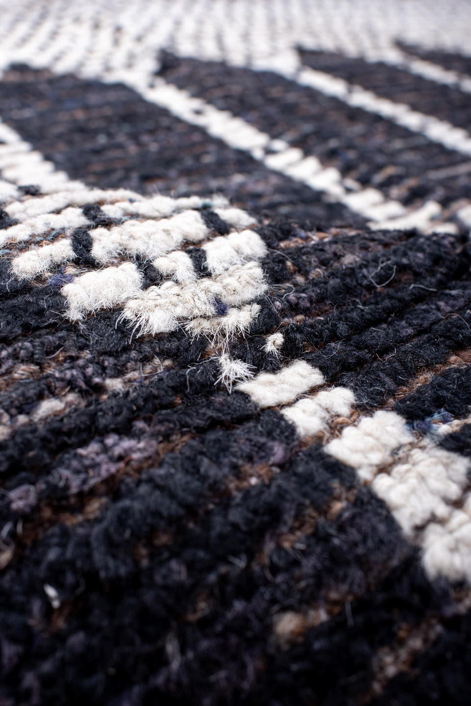 12' x 15' one-of-a-kind handmade vintage Tulu oversize rug. Color palette: ivory, charcoal, taupe, brown, gray, black, beige