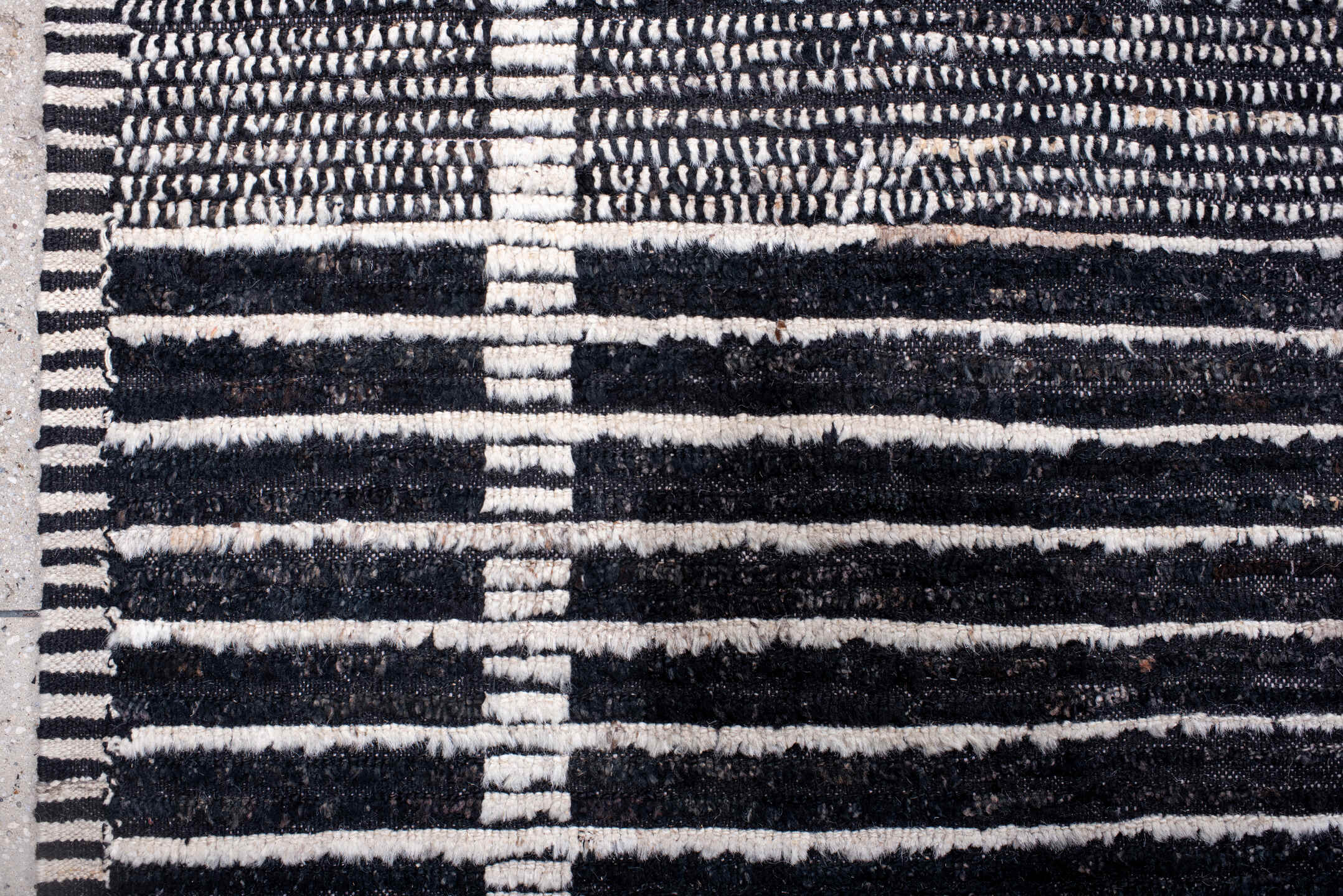 13' x 19' one-of-a-kind handmade vintage Tulu oversize rug. Color palette: charcoal, ivory, slate, black, gray