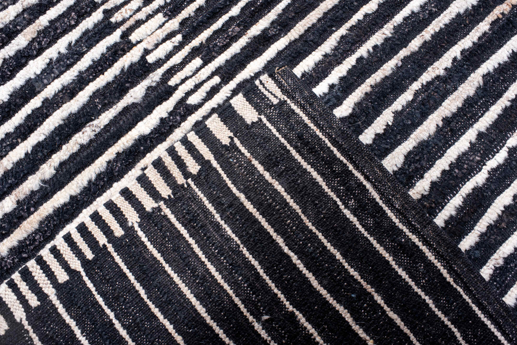 13' x 19' one-of-a-kind handmade vintage Tulu oversize rug. Color palette: charcoal, ivory, slate, black, gray