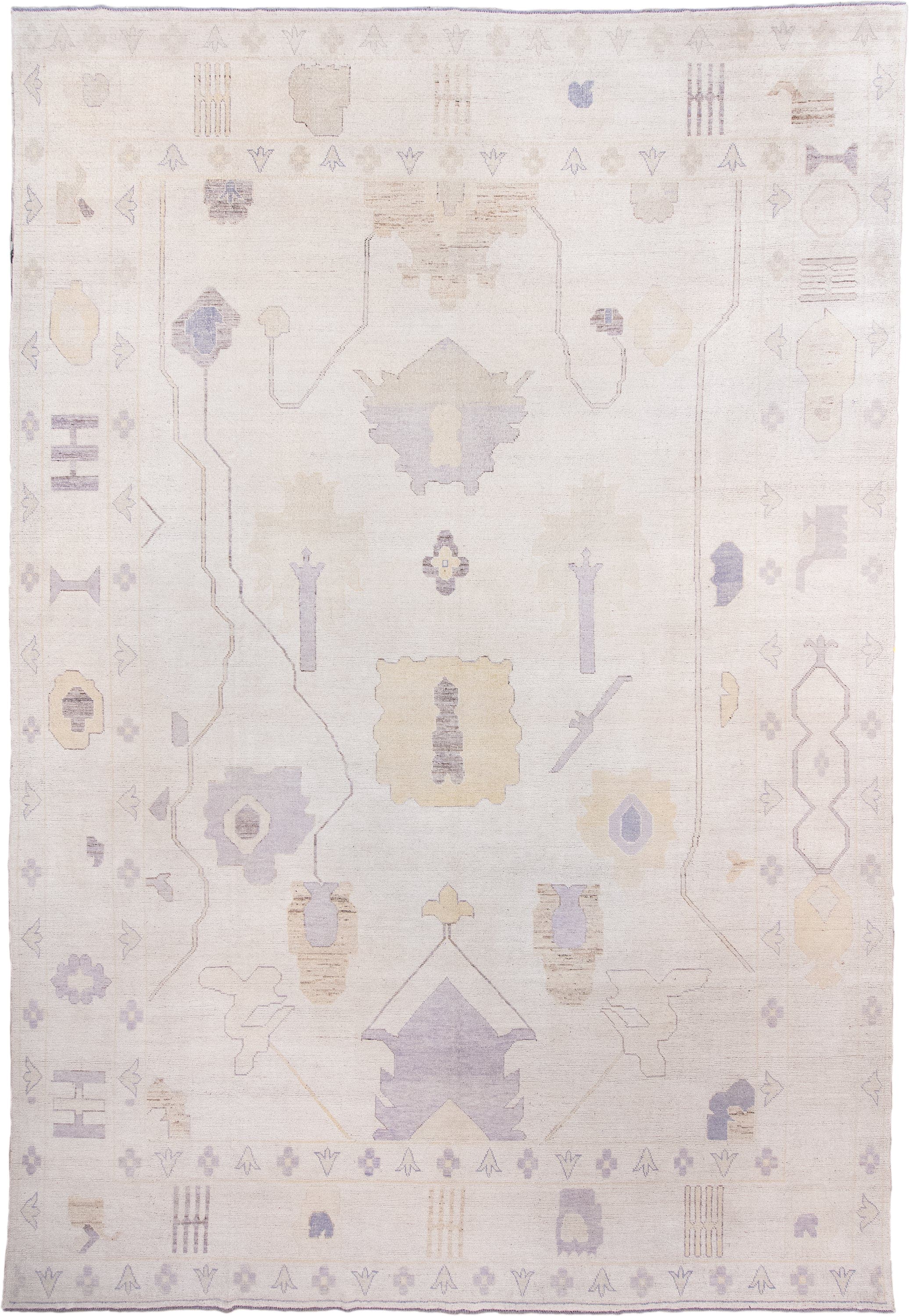 13' x 19' one-of-a-kind handmade vintage Oushak oversize rug. Color palette: ivory, lavender, cream, pale gold, beige, taupe