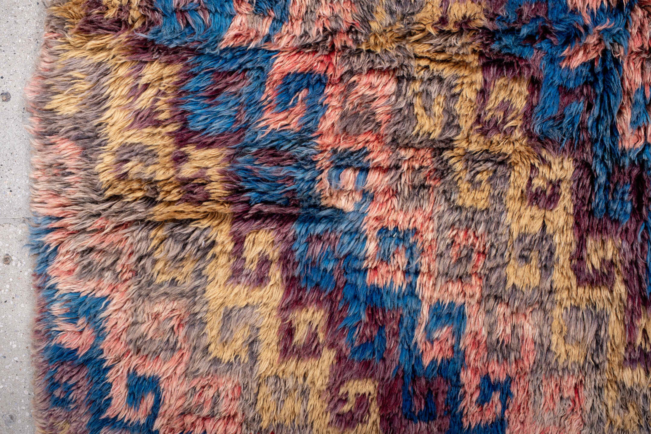 4' x 5' one-of-a-kind handmade vintage Moroccan small size rug. Color palette: taupe, blue, gold, plum, coral, gray, beige