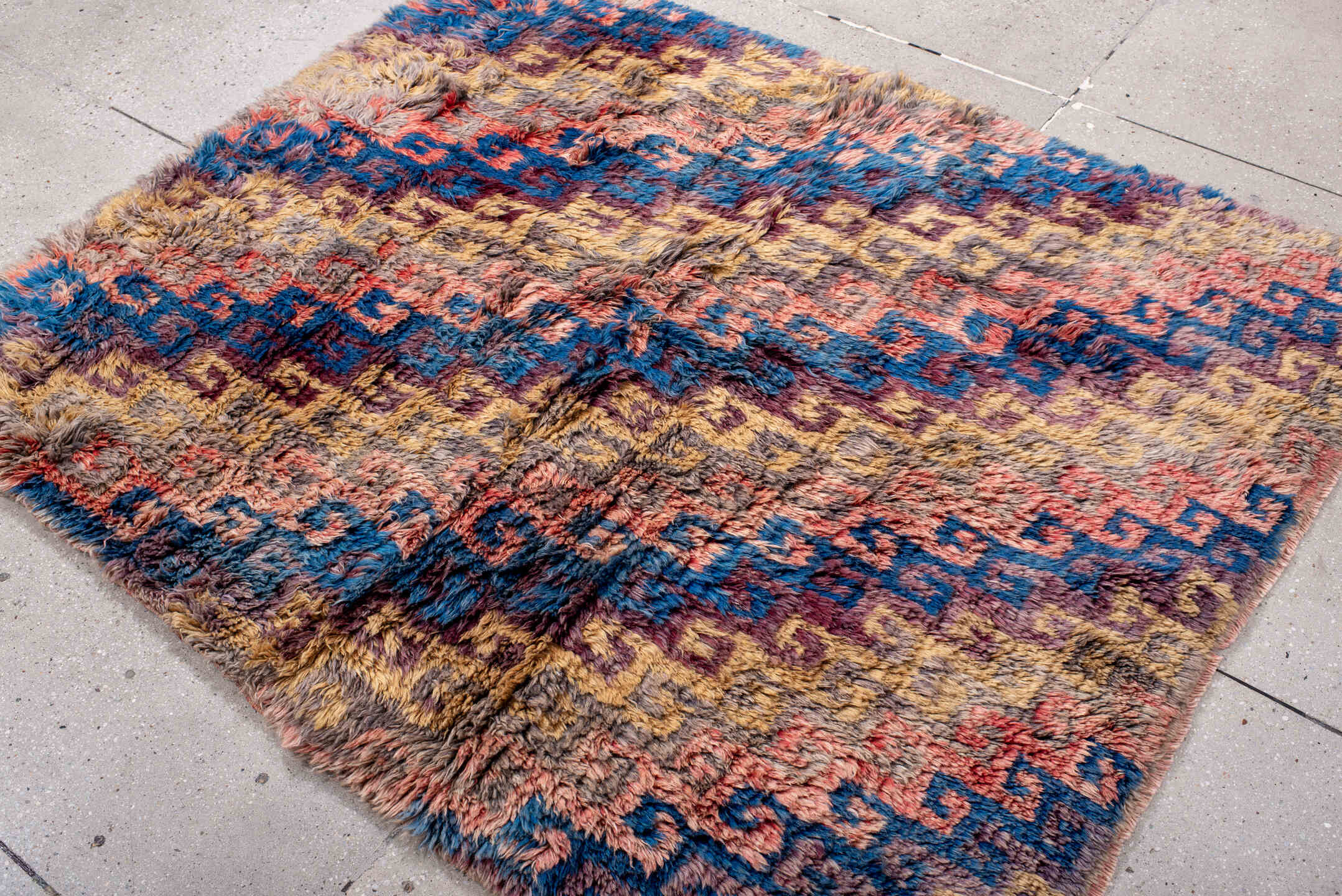 4' x 5' one-of-a-kind handmade vintage Moroccan small size rug. Color palette: taupe, blue, gold, plum, coral, gray, beige