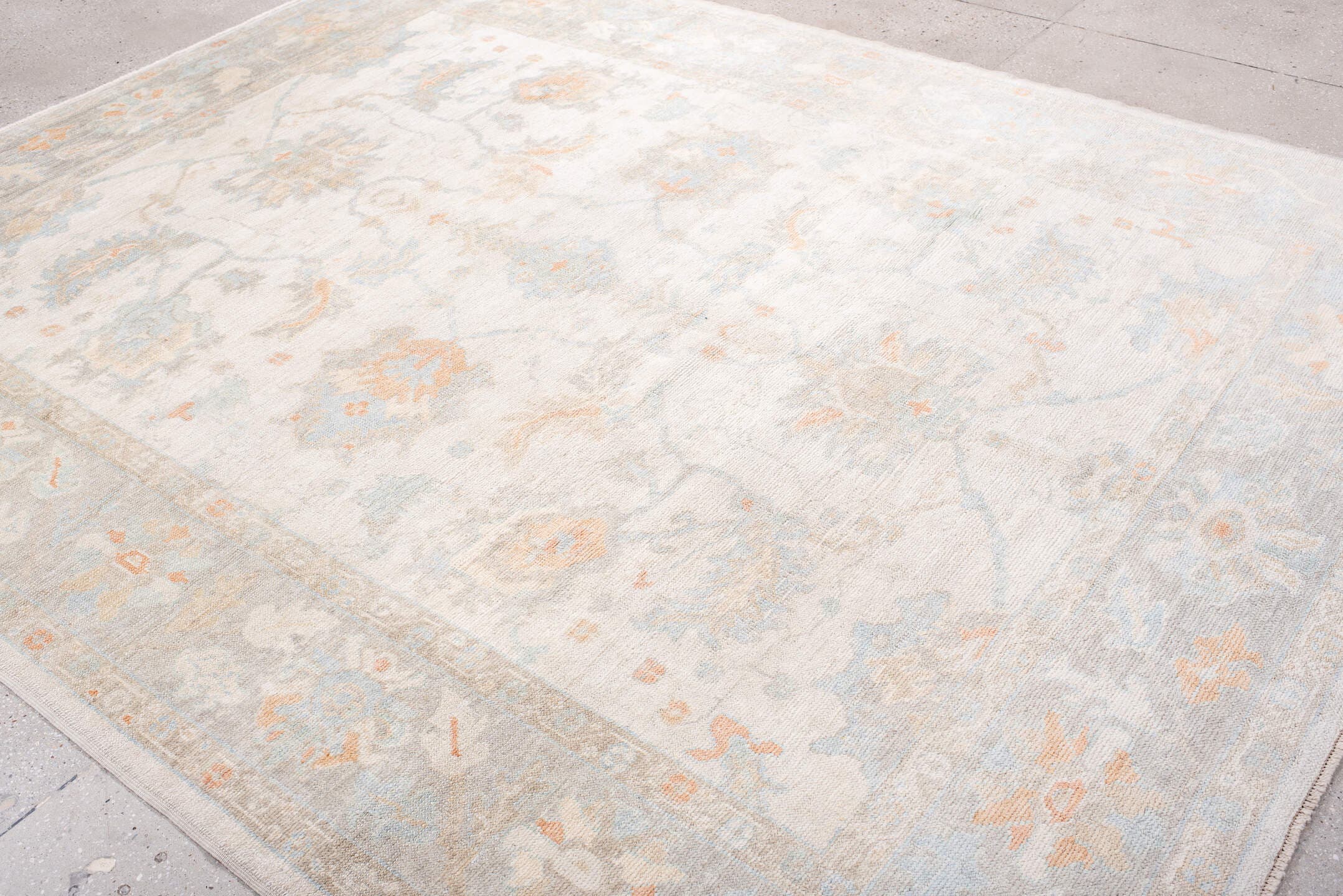 8' x 10' one-of-a-kind handmade vintage Oushak large size rug. Color palette: ivory, pale blue, blush, cream, taupe, peach