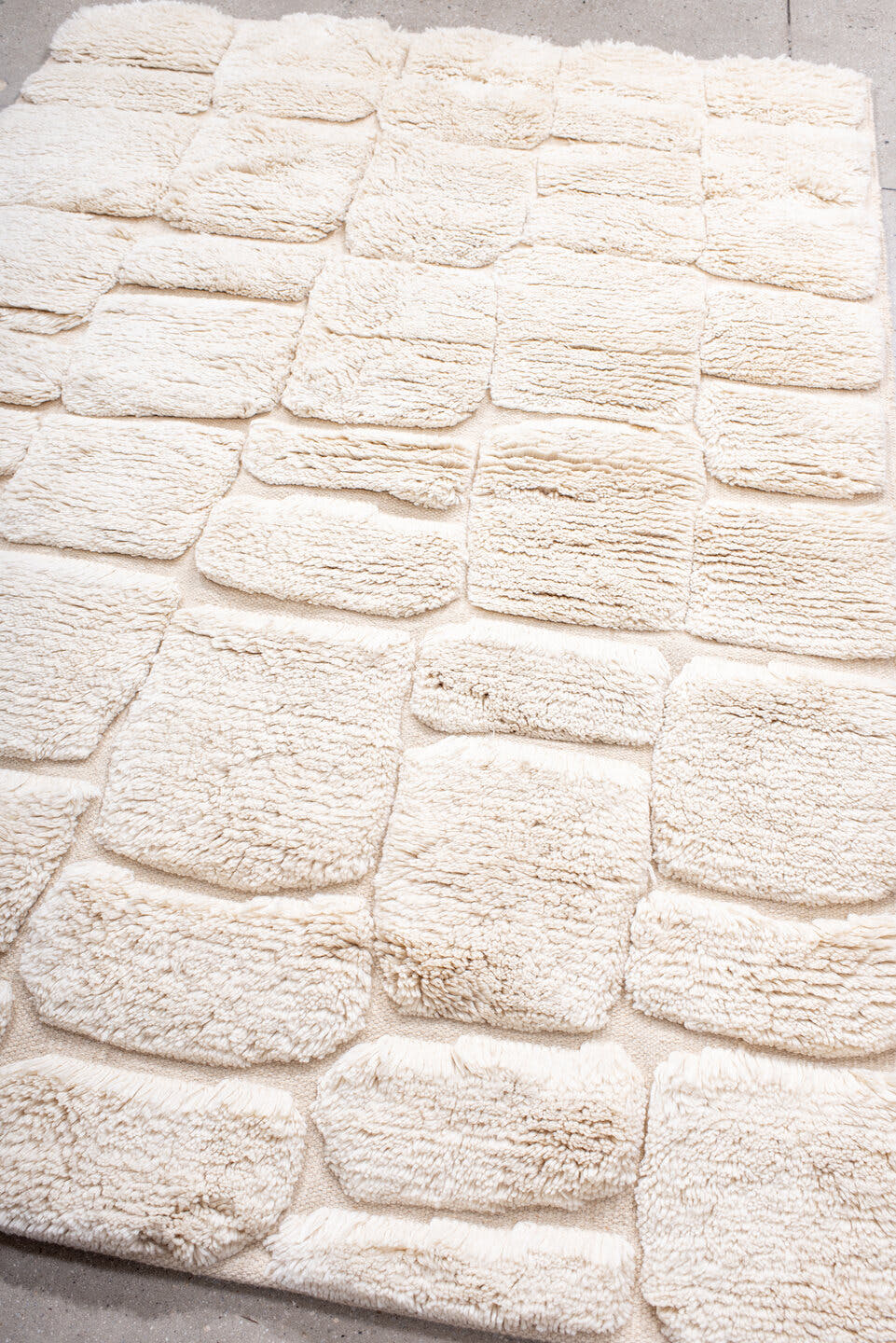 5' x 7' one-of-a-kind handmade vintage Moroccan medium size rug. Color palette: ivory, cream, beige