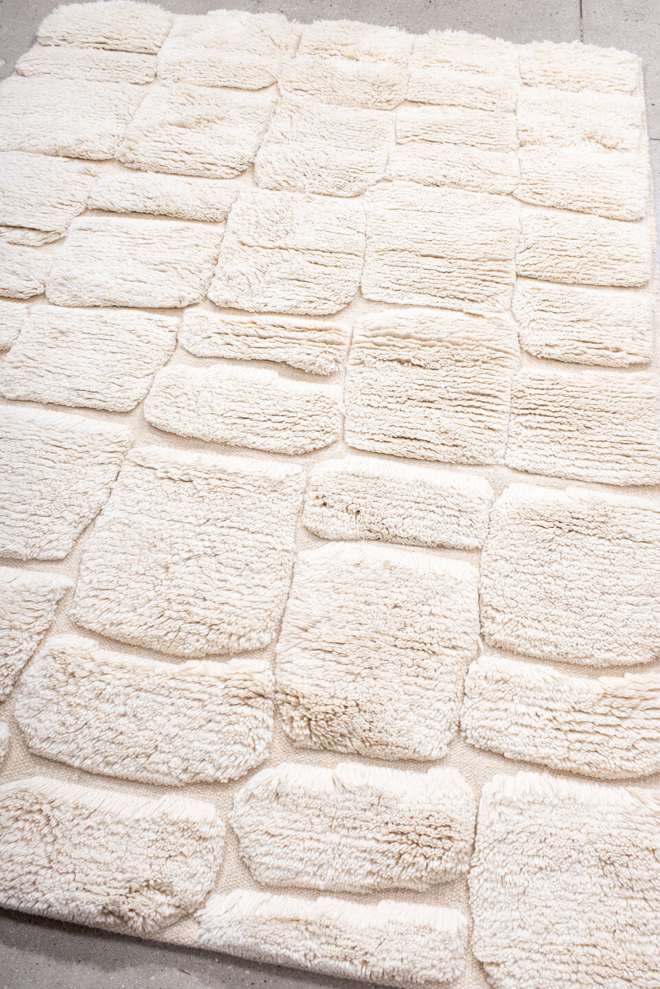 5' x 7' one-of-a-kind handmade vintage Moroccan medium size rug. Color palette: ivory, cream, beige