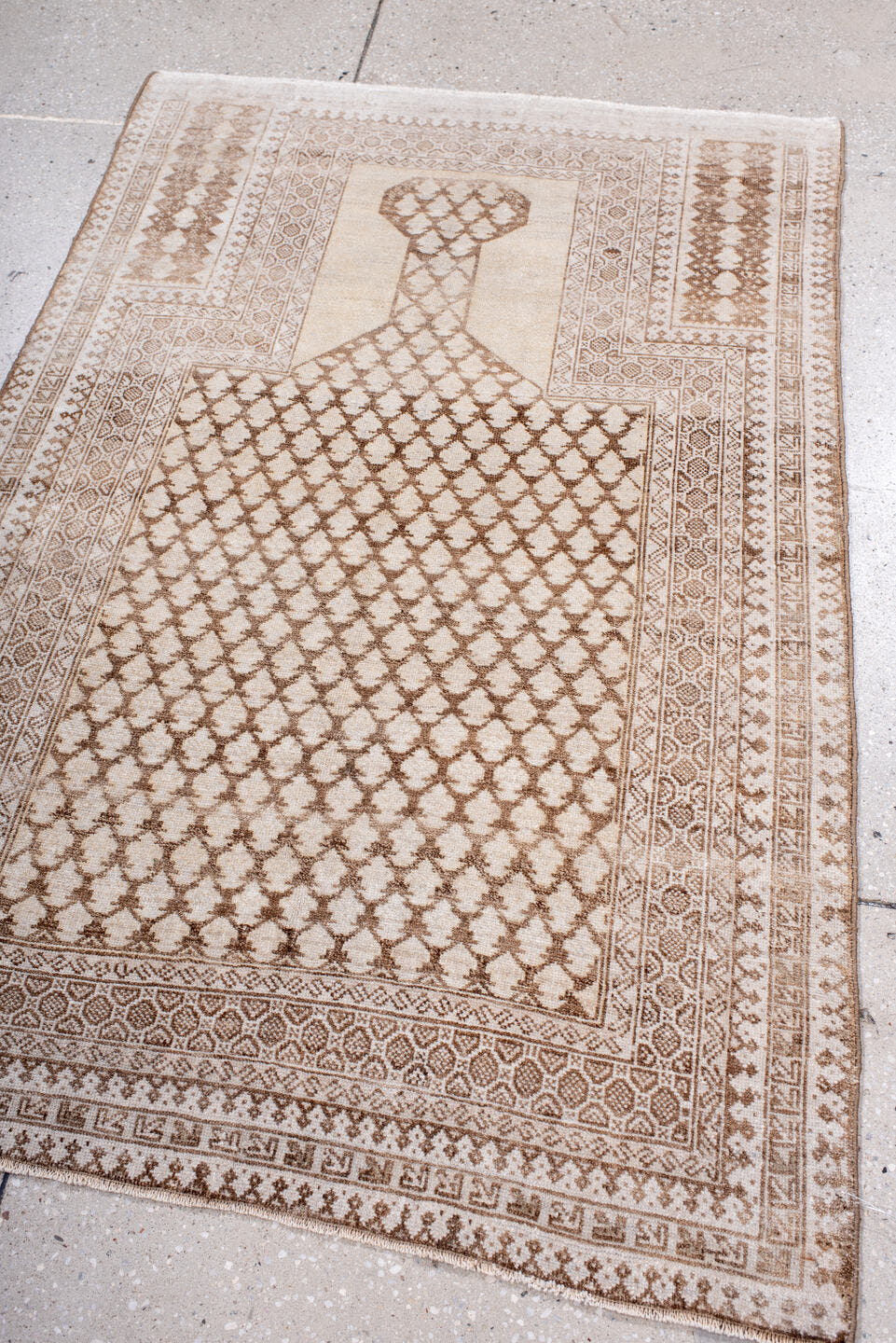 3' x 4' one-of-a-kind handmade antique Belouch small size rug. Color palette: ivory, camel, taupe, beige, sand, brown, gray
