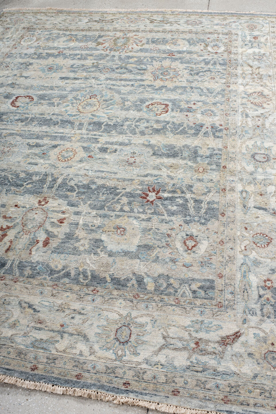 7' x 9' one-of-a-kind handmade vintage India large size rug. Color palette: ivory, pale blue, sky blue, rust, taupe, slate