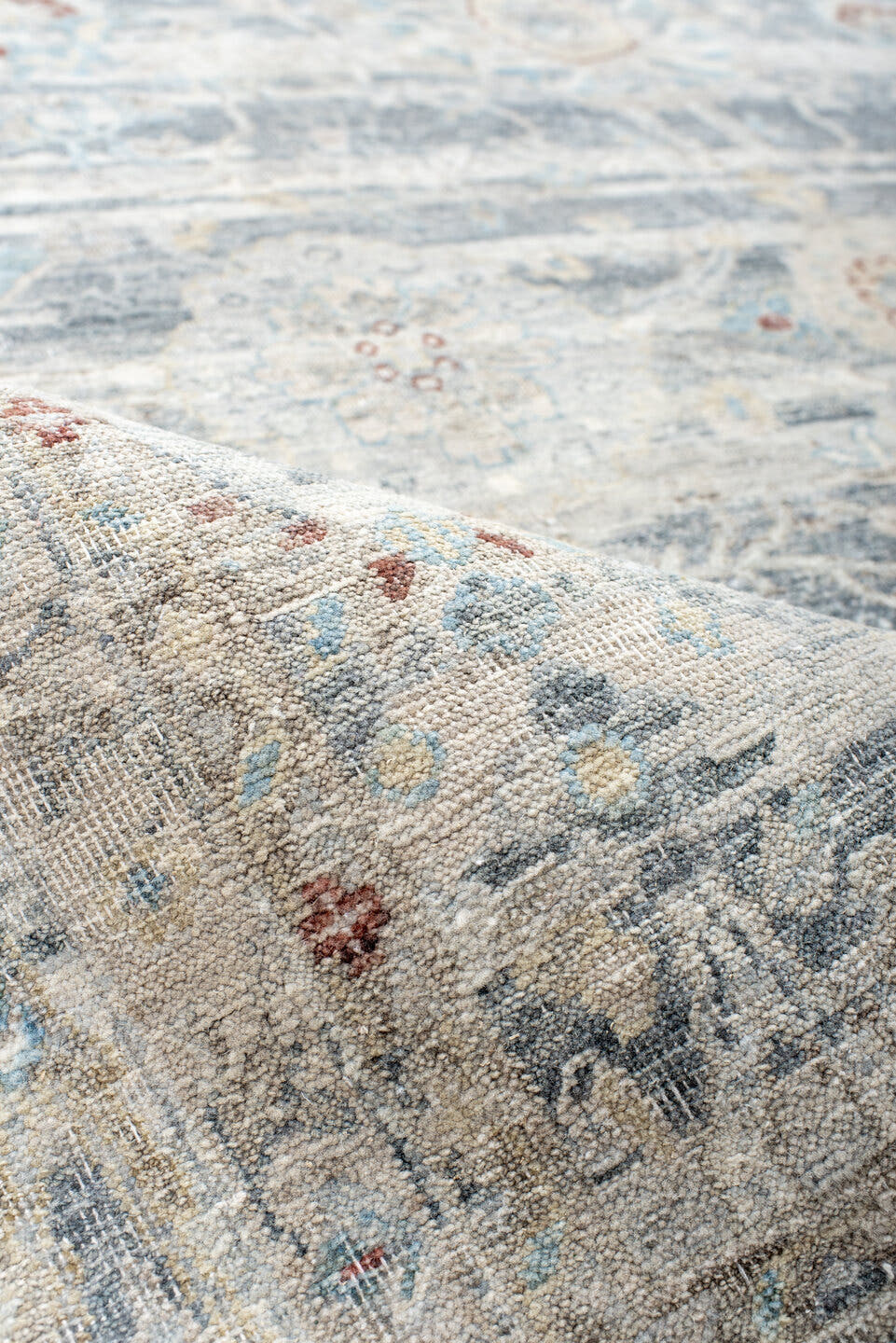 7' x 9' one-of-a-kind handmade vintage India large size rug. Color palette: ivory, pale blue, sky blue, rust, taupe, slate