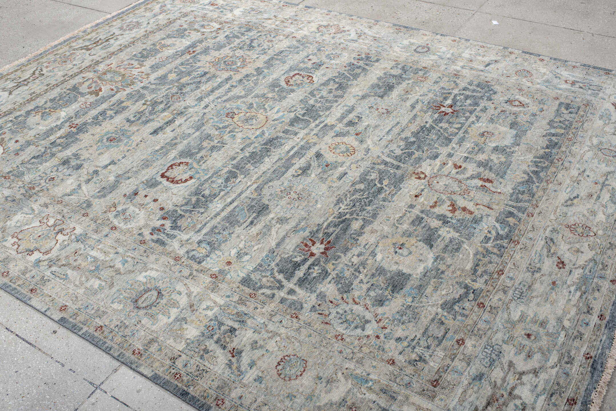 7' x 9' one-of-a-kind handmade vintage India large size rug. Color palette: ivory, pale blue, sky blue, rust, taupe, slate
