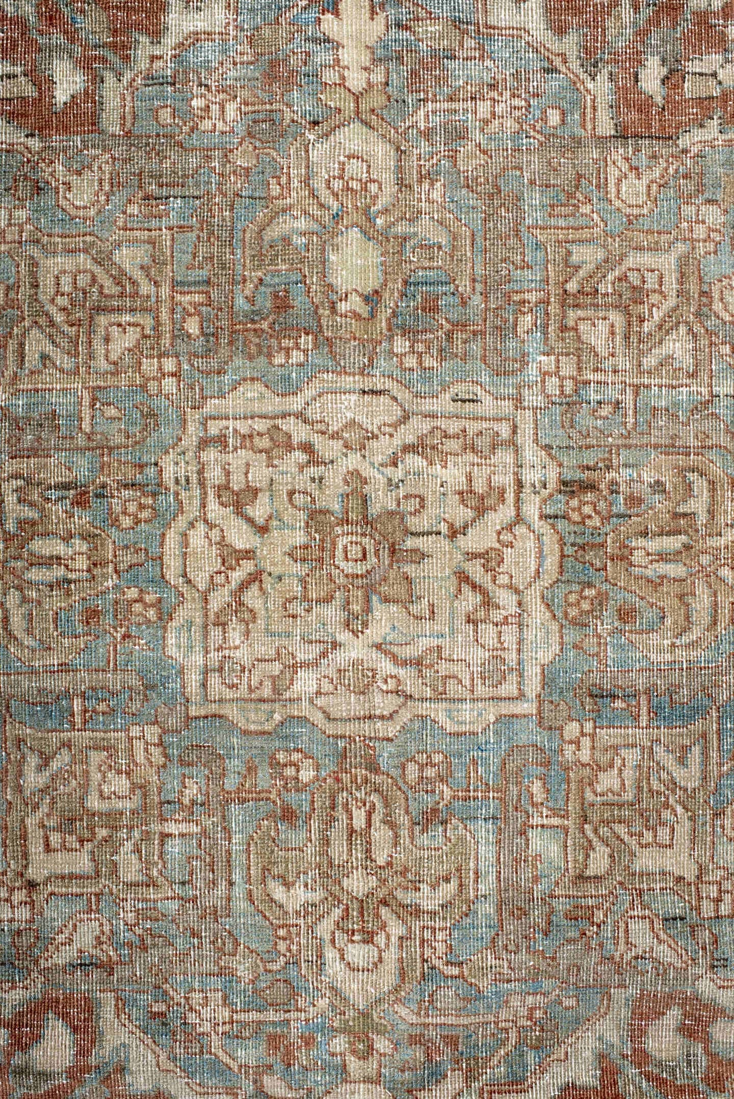 7' x 9' one-of-a-kind handmade antique Heriz rug. Color palette: ivory, sky blue, rust, taupe, camel, brown, light blue