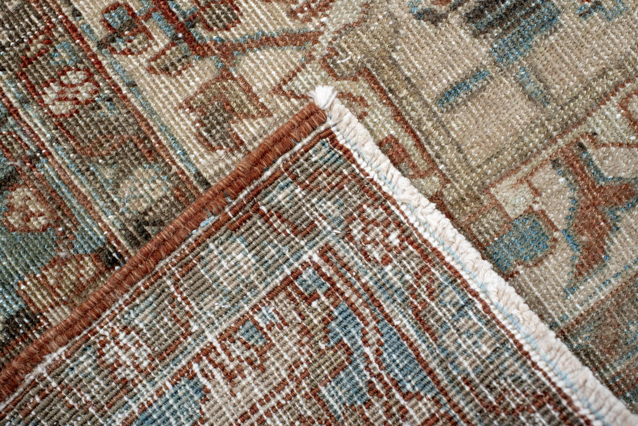 7' x 9' one-of-a-kind handmade antique Heriz rug. Color palette: ivory, sky blue, rust, taupe, camel, brown, light blue