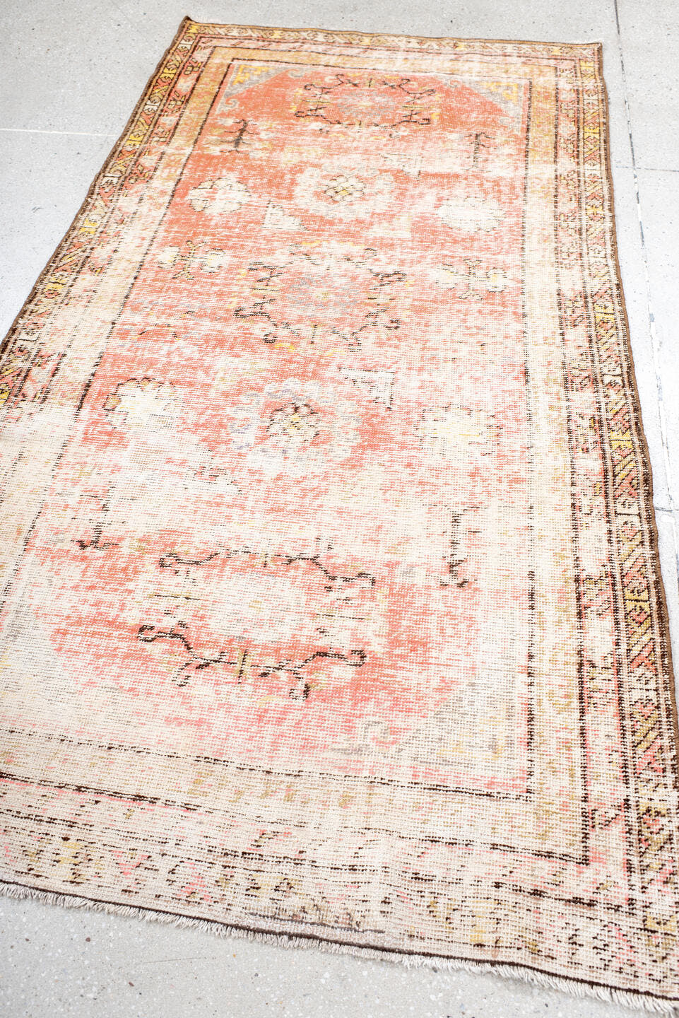 3' x 7' one-of-a-kind handmade antique Khotan rug. Color palette: ivory, coral, peach, taupe, brown, gold, charcoal