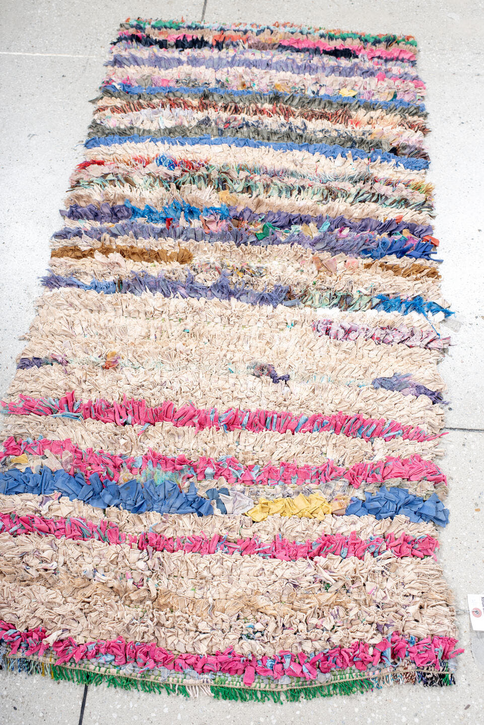 2' x 5' one-of-a-kind handmade vintage Rag Rug small size rug. Color palette: cream, pink, lavender, cobalt, charcoal, teal
