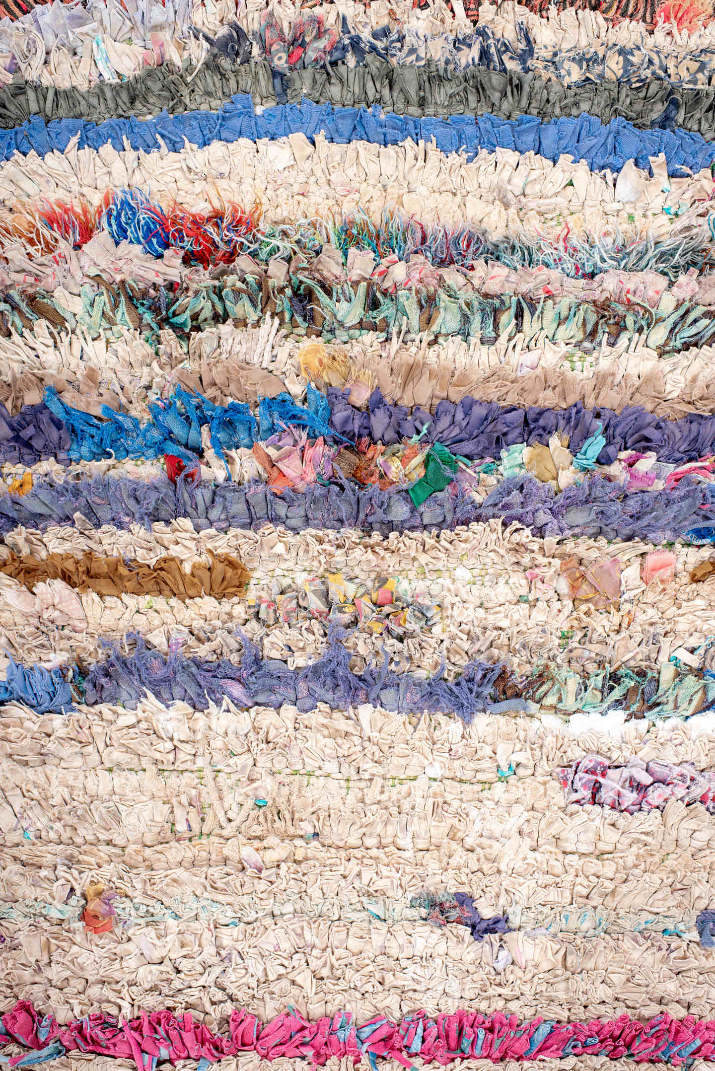 2' x 5' one-of-a-kind handmade vintage Rag Rug small size rug. Color palette: cream, pink, lavender, cobalt, charcoal, teal