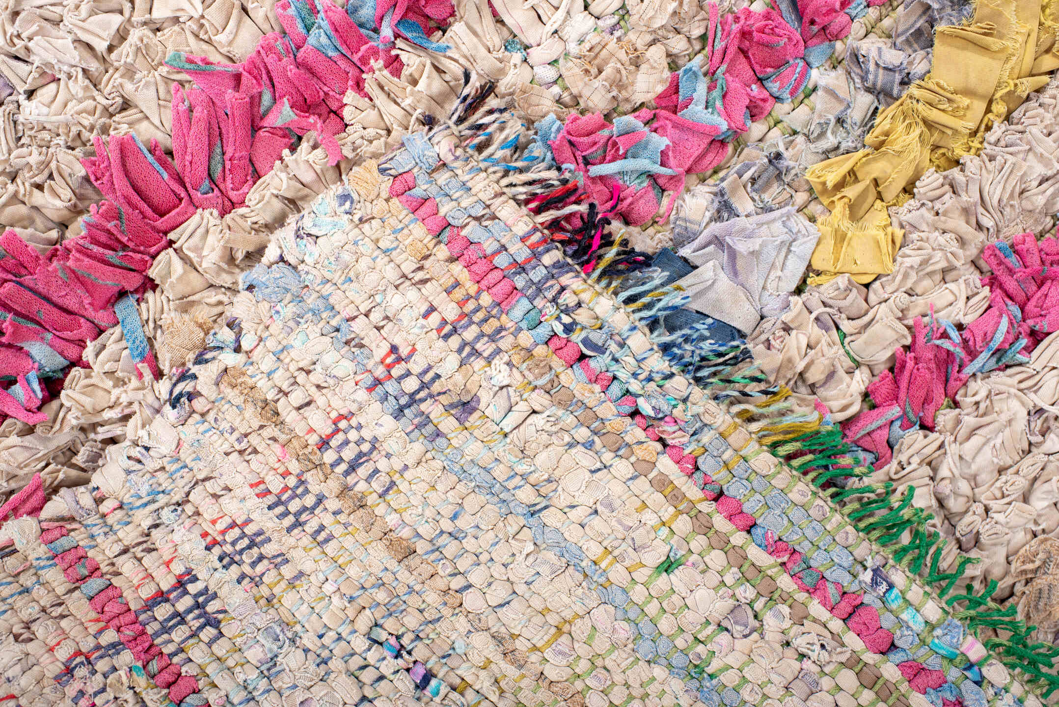 2' x 5' one-of-a-kind handmade vintage Rag Rug small size rug. Color palette: cream, pink, lavender, cobalt, charcoal, teal