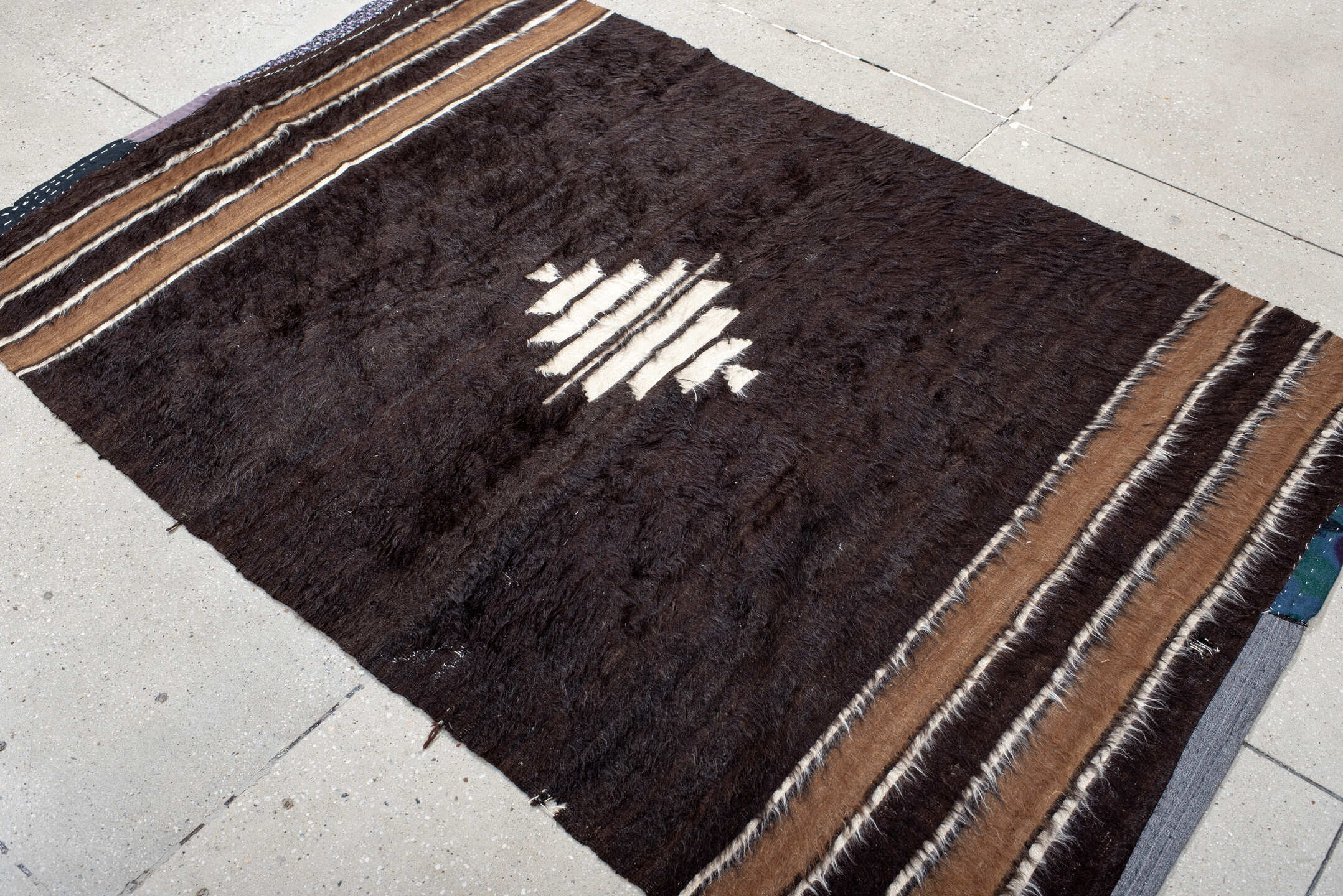 4' x 6' one-of-a-kind handmade antique Tulu small size rug. Color palette: brown, camel, ivory, charcoal, beige, gray, black