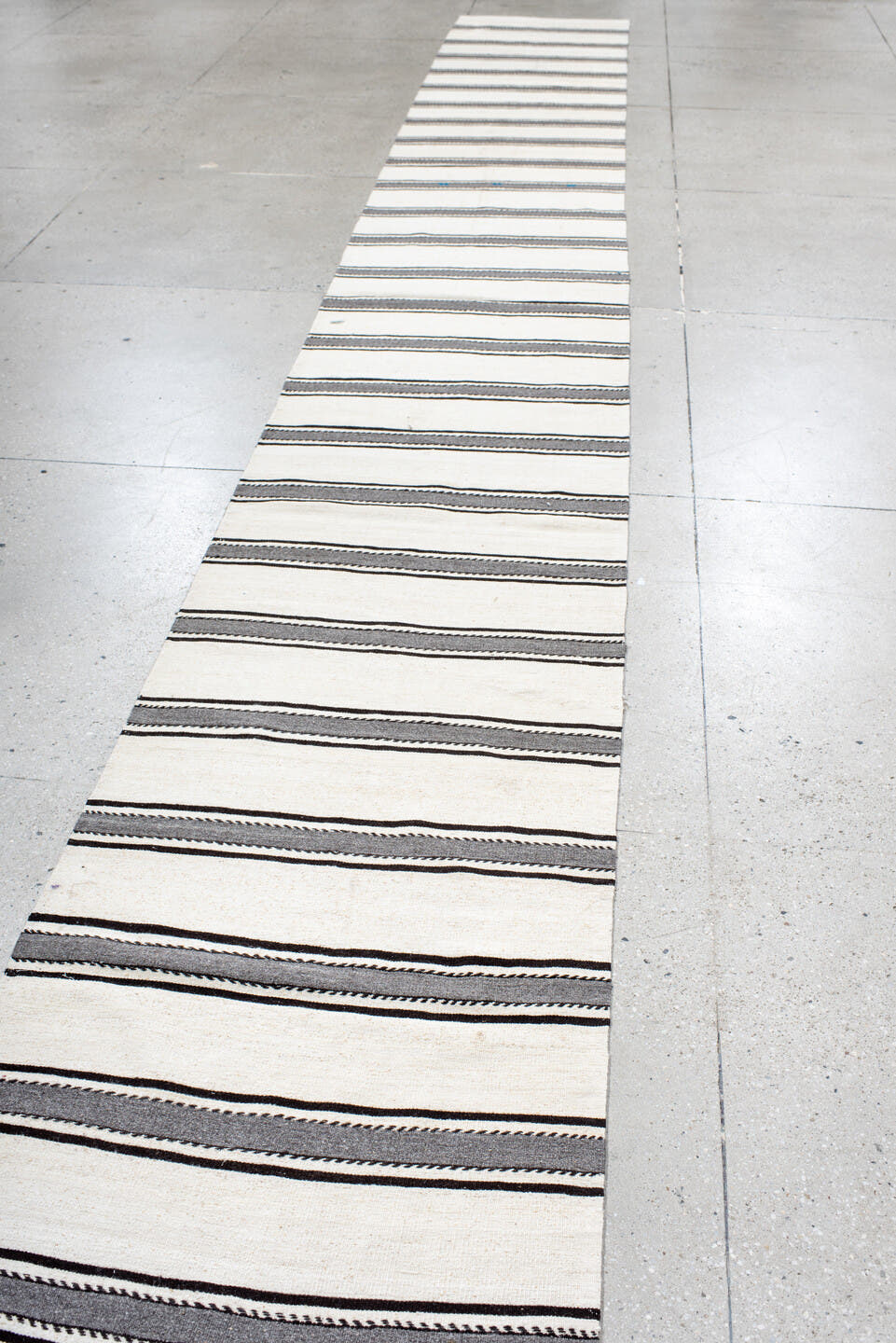 2' x 22' one-of-a-kind handmade antique Kilim runner rug. Color palette: ivory, charcoal, brown, gray, black