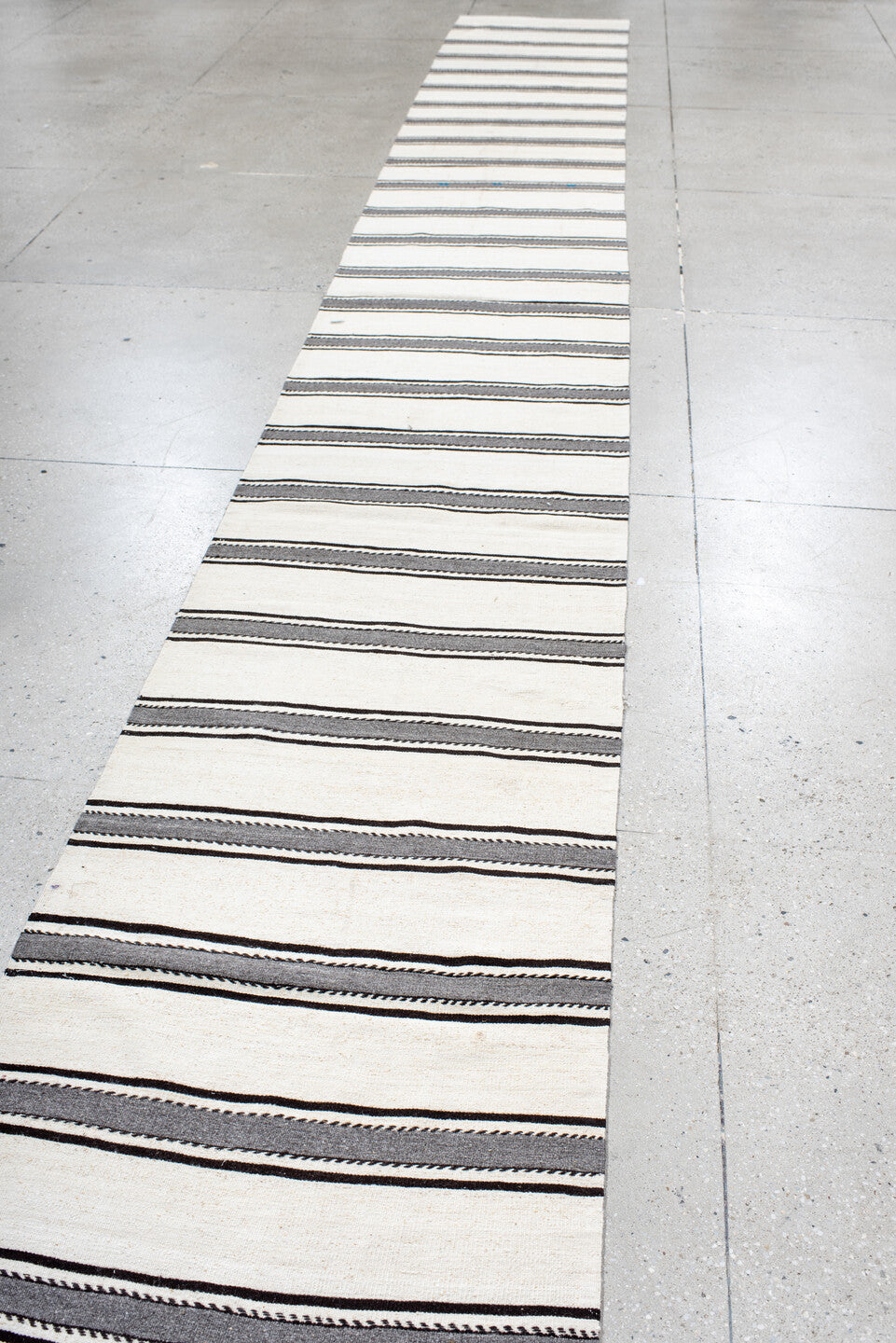 2' x 22' one-of-a-kind handmade antique Kilim runner rug. Color palette: ivory, charcoal, brown, gray, black