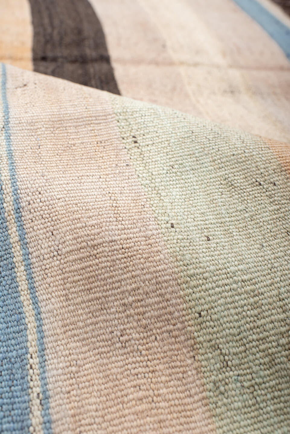 2' x 6' one-of-a-kind handmade vintage runner rug. Color palette: ivory, pale blue, peach, brown, cream, charcoal, lavender