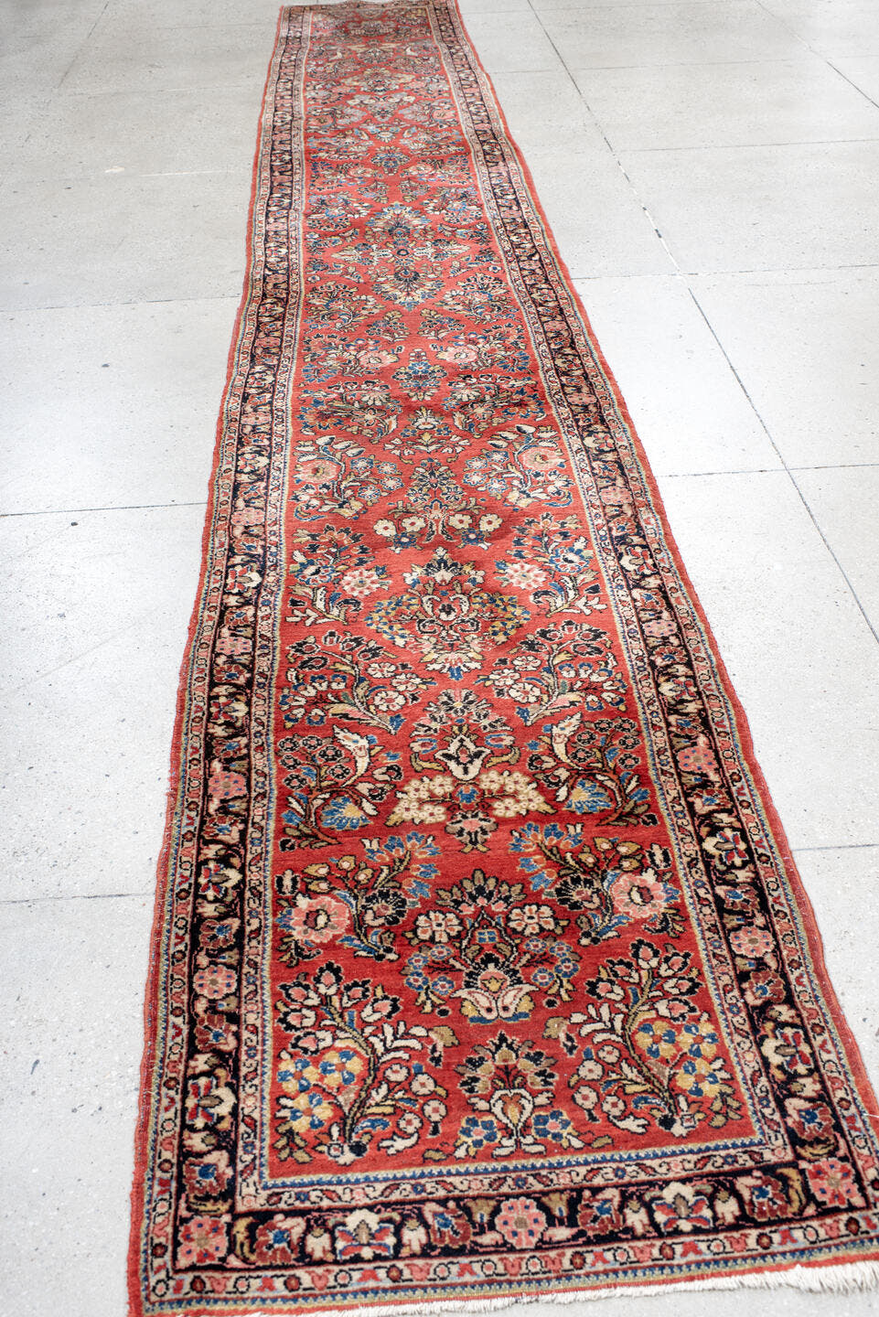2' x 18' one-of-a-kind handmade antique Sarouk runner rug. Color palette: rust, ivory, navy, soft blue, rose, charcoal