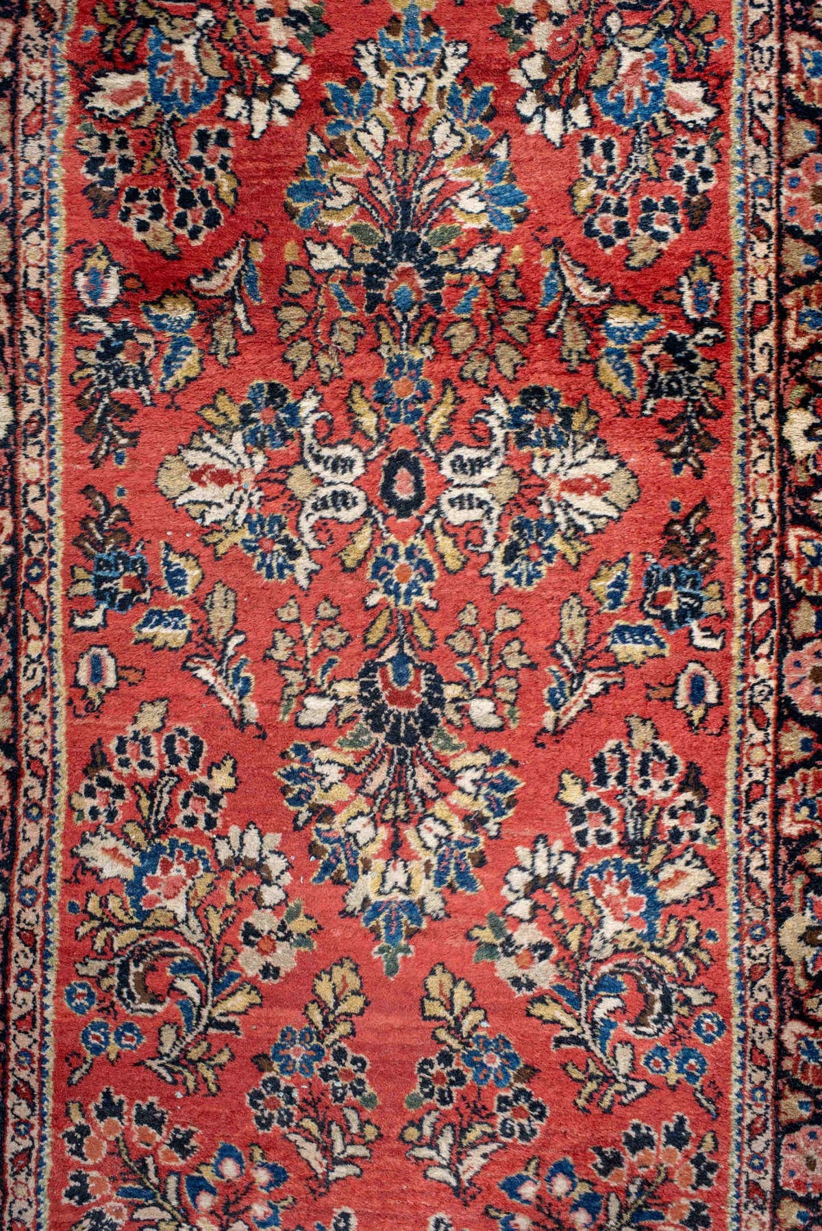 2' x 18' one-of-a-kind handmade antique Sarouk runner rug. Color palette: rust, ivory, navy, soft blue, rose, charcoal
