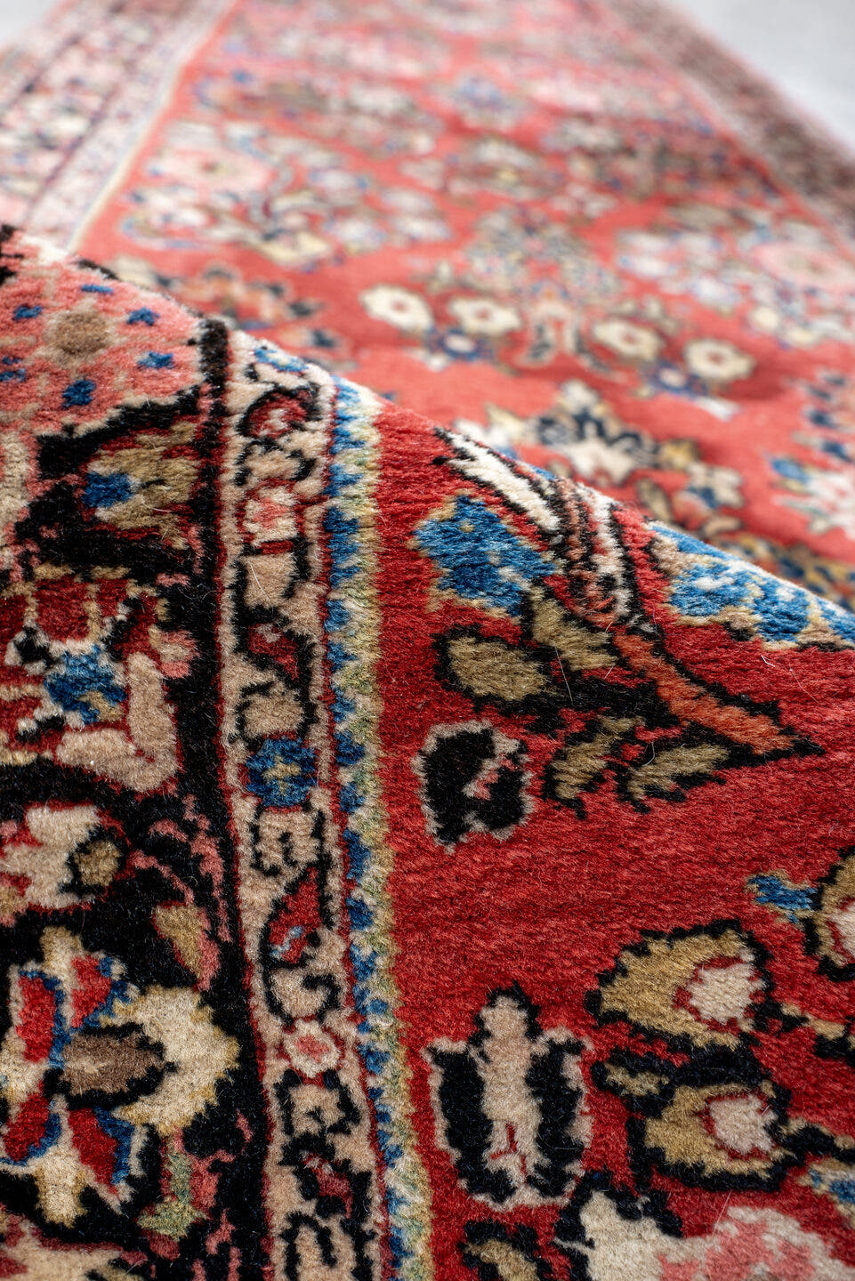 2' x 18' one-of-a-kind handmade antique Sarouk runner rug. Color palette: rust, ivory, navy, soft blue, rose, charcoal