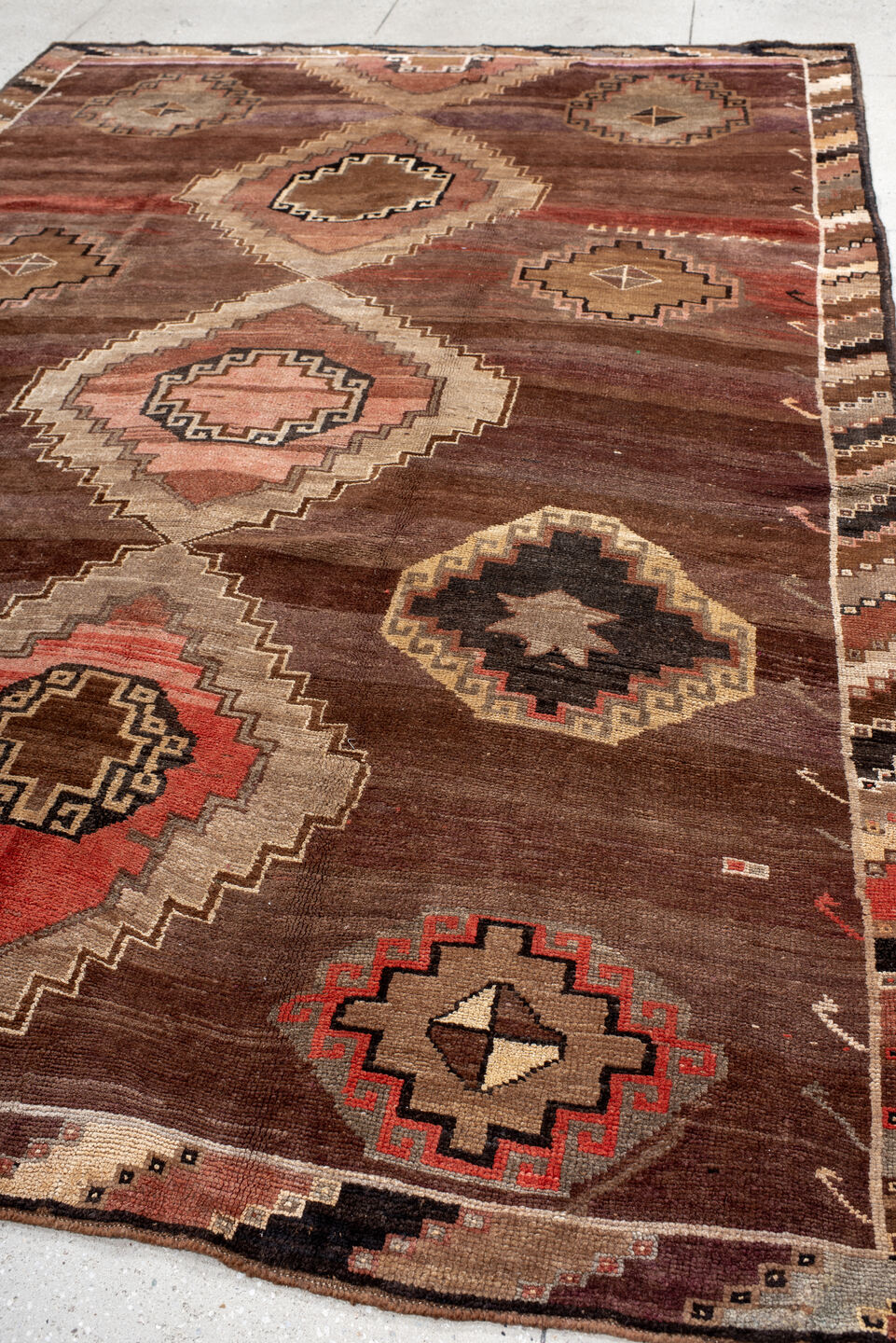 7' x 11' one-of-a-kind handmade vintage Kars large size rug. Color palette: brown, gray, maroon, off-white, orange, pink