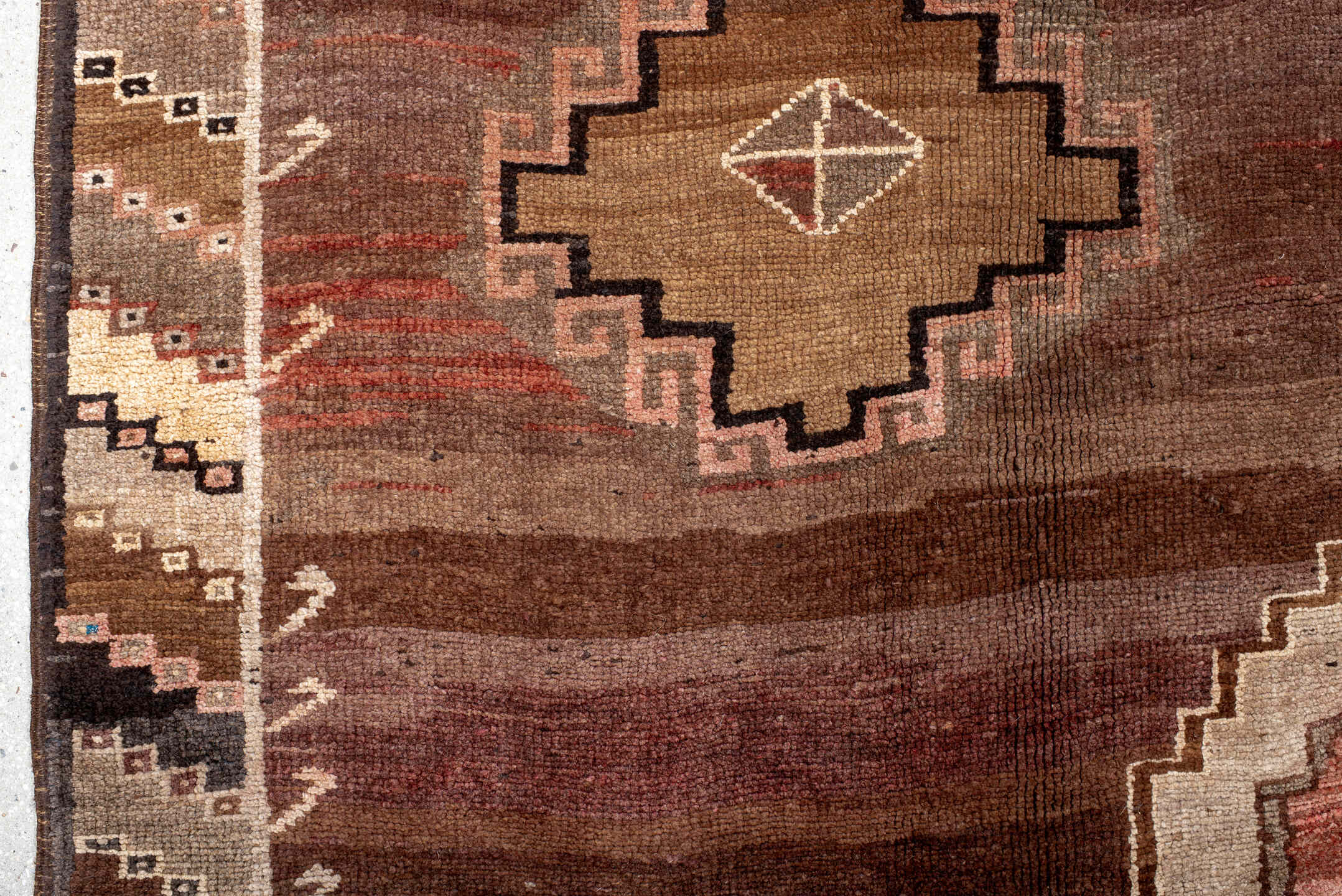 7' x 11' one-of-a-kind handmade antique Kars large size rug. Color palette: brown, taupe, rose, rust, ivory, charcoal