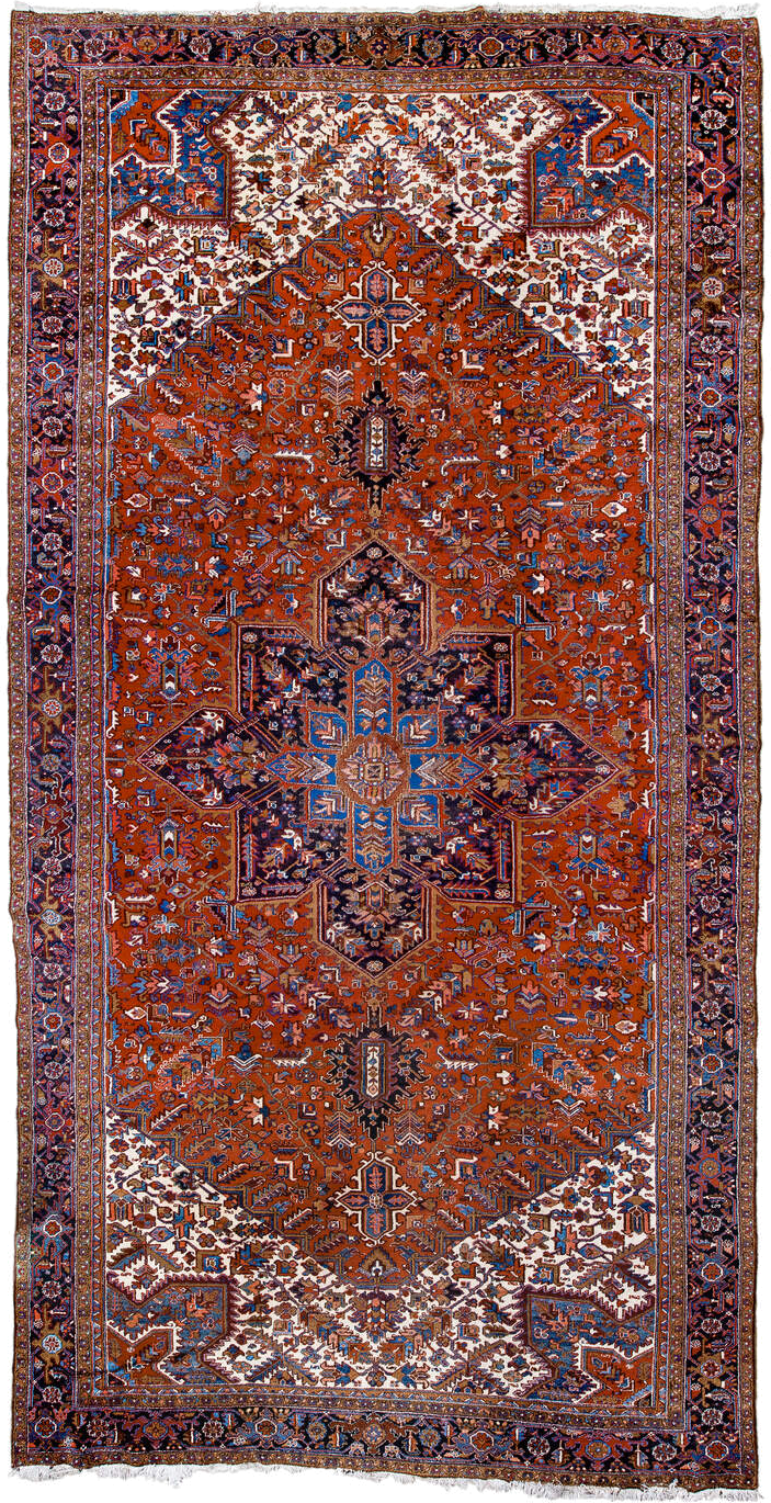 11' x 21' one-of-a-kind handmade antique Heriz oversize rug. Color palette: rust, ivory, navy, cobalt, terra cotta, charcoal
